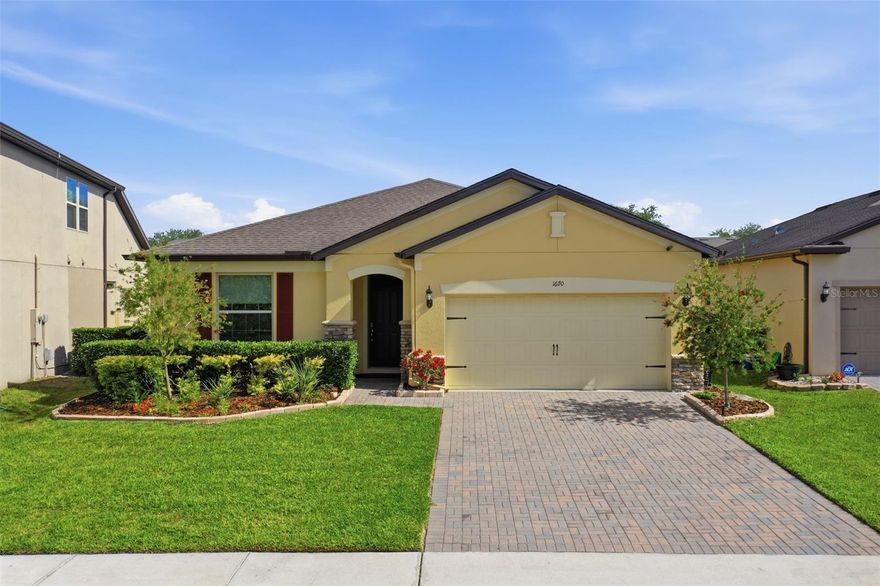Beautifully maintained and move in ready, this home at 1670 Regal River offers a light filled, inviting layout with tasteful updates throughout. Fresh interior and exterior paint completed in 2024, including the garage and closets, gives the home a crisp, modern feel from the moment you step inside. The spacious kitchen is designed for both function and style, featuring granite countertops, stainless steel appliances, abundant cabinetry, and a large center island that flows into the main living areas, ideal for everyday living and entertaining. Natural light highlights the homes well cared for finishes and thoughtful design. Step outside to a covered, screened lanai overlooking a nicely sized backyard, offering space to relax, entertain, or create your own outdoor retreat. The paver driveway and attractive landscaping enhance the curb appeal, while the attached garage adds convenience and storage. Located in Ocoee with easy access to major roadways, shopping, dining, and everyday amenities, this home offers a great combination of comfort, style, and location.
