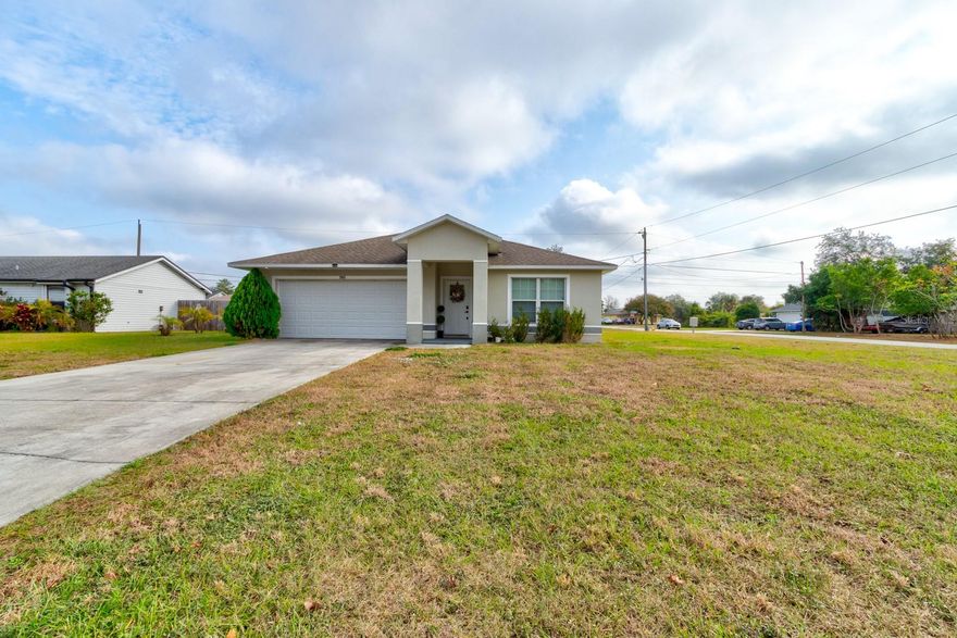 **PRICE IMPROVEMENT**Welcome home to this beautifully maintained 3 bedroom, 2 bath, 2-car garage residence on a generous ¼ acre homesite in Deltona. Once inside, you're greeted by fresh, new flooring and a neutral color palette that makes the space feel bright, open, and move-in ready. The heart of the home is the combined kitchen and living room, creating a true open-concept great room that's perfect for both everyday living and entertaining. The kitchen offers ample cabinetry, plenty of counter space, and a convenient layout that keeps you connected to guests or family gathered in the living area. The spacious living room easily accommodates a large sectional and media center, with room left over for a dining area or home office nook. The split bedroom layout provides privacy for the primary suite, which features a comfortable bedroom and an ensuite bath. Two additional bedrooms and a second full bath offer flexibility for guests, family, or a dedicated workspace.

Step outside and enjoy the possibilities of the quarter acre lot where there's ample room for a future enclosed patio, playset, garden, or even a pool, all while still having green space to enjoy.

An outstanding bonus is the solar panel system, helping to offset electric costs and support a more energy-efficient lifestyle. You will appreciate the alarm system and ring doorbell for that added layer of security. Located just a short drive from I-4, local shopping, dining, schools, and parks, this home blends comfort, convenience, and long-term savings. Don't miss your chance to make this Deltona gem your own!