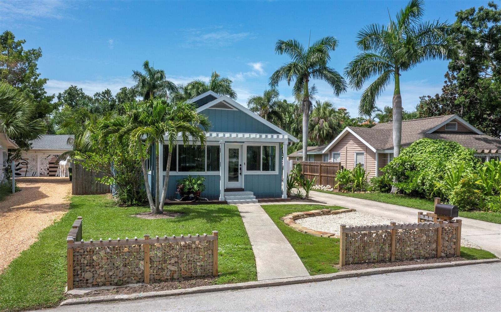 This charming 3 bed 2.5 bath cottage was originally constructed in 1915, and completely remodeled and renovated in 2018. This home is located on a quiet street in one of the most desirable West of the Trail neighborhoods, the Hudson Bayou. It's walking distance to Selby Gardens, Downtown Sarasota, Bayfront Park, and restaurants and shops. Perfect "old Florida" bungalow with the front porch that we all love AND a pool in the backyard. High ceilings, 3 bedrooms 2-1/2 baths in main house. Attached to the garage is a "pool house" with an extra 1/2 bathroom that could easily be made into a guest room. The kitchen has custom cabinets/countertops and there are heart pine floors throughout. HVAC 2019, new roof 2020. impact windows on front porch.