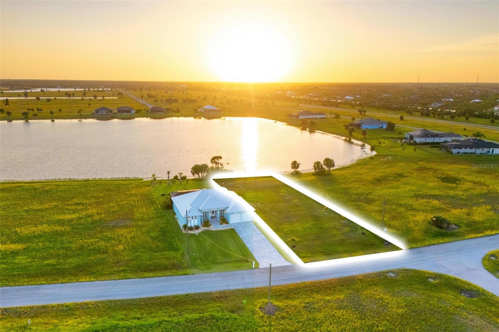 Expansive lakefront lot with spectacular sunset views! The land has been upgraded to include lake-fed irrigation and landscaping. Can be a part of a package deal with the purchase of the house adjacent at 99 Wren. The 45-acre lake invites you to enjoy fishing, kayaking, and paddle boating. Some residents in the community opt to build docks and seawalls. Located in The Meadows of Placida, this uniquely peaceful neighborhood features expansive lots and million-dollar waterside homes. You're just ten minutes from the nearest Publix and a short drive to the world-renowned Boca Grande beaches and historic seaside town. Enjoy nearby Englewood, Manasota Key, Port Charlotte, and Venice for a variety of dining and shopping options, including fabulous waterside dining/restaurants. The local public boat ramps are less than 10 minutes away, where you can directly access the beautiful Gulf waters either by sail boat or power boat. A fishing and boating enthusiast will enjoy knowing this is the iconic Tarpon "Silver King" Capital of the World due to the deep waters, natural passes and inshore estuary.
