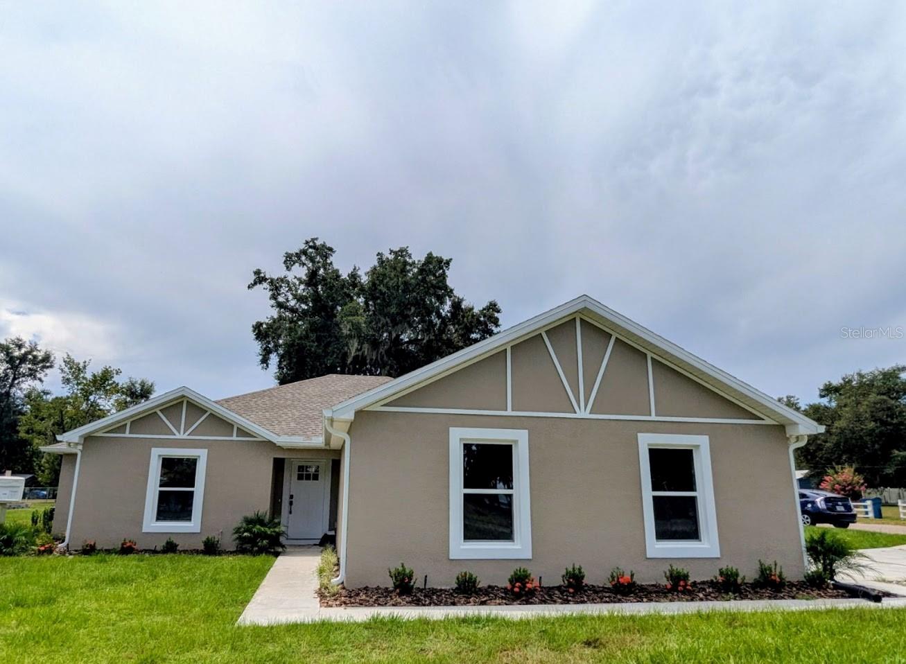Welcome to this brand-new 3-bedroom, 2-bath home spanning 1,545 square feet with an open floor plan and luxury vinyl plank flooring throughout. The kitchen and both baths feature gleaming granite countertops, while a mudroom and an inside laundry room with a utility sink sit adjacent to the side-loading two-car garage for seamless daily living. The master suite boasts a spacious walk-in closet, and sliding glass doors off the living area open onto a covered lanai for year-round enjoyment. Ideally situated close to schools, just half a mile from the fire department, and one mile from the Peace River’s kayaking, paddleboarding, and fishing opportunities, this home perfectly marries modern style, practical features, and outdoor adventure. Best of all, no HOA!