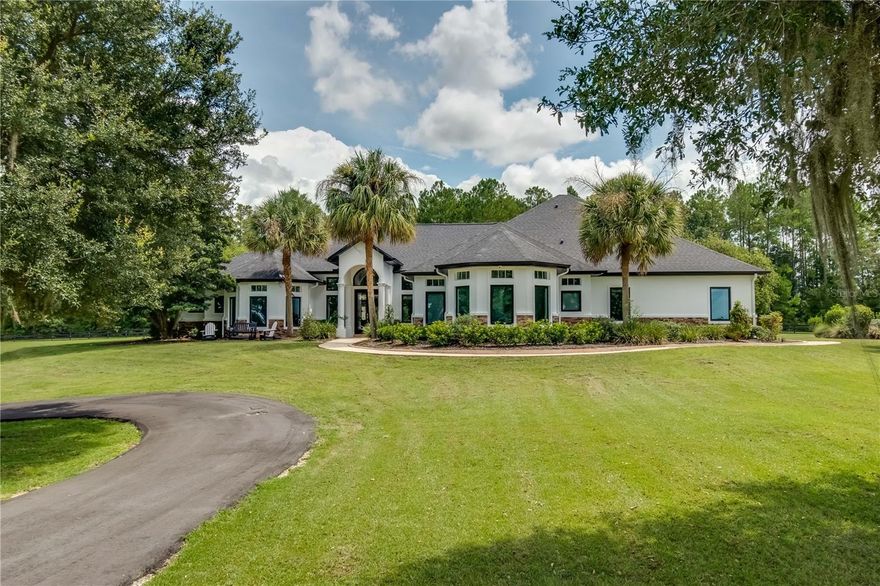 Under contract-accepting backup offers. This beautiful 25 acre horse farm comes with spectacular hill top views and is ready to go! With an astonishing interior and exterior renovation just recently completed, this farm is turn key and ready for immediate occupancy. The 5,020 sq ft main residence is a 5 bedroom 5 1/2 bath and overlooks a breathtaking rolling landscape complete with total privacy.  As if this property needed more, it also includes a spacious 900 sq ft 2 bedroom 1 bath guest cottage that also just finished a complete renovation, perfect for family visitors or boarding accommodations giving this property a total of 5,920 sq ft of living space. Conveniently located just 20 minutes from World Equestrian Center and HITS right around the corner, this location is perfect for those looking for a quite country side retreat but still want to be close to all the action. This hilltop property has high and dry pastures and free of wetlands. The farm includes a pristine 6 stall block construction horse barn, complete with an air conditioned office as well as tack room, including a full bathroom, washer & dryer, including an automatic fly control system and foaling cameras. The farm also includes a 165x65 ft riding arena, a storage barn, 2 wells, 5 paddocks with 4 board fencing, RV hookup, brand new asphalt driveways, and a beautiful fish pond. Some of the additional features of the main residence include a Sub-Zero refrigerator, 2 dishwashers, brand new beautiful quartz countertops, new wood plank flooring, brand new low-E windows, central vac, 1,000 gallon propane whole home generator, gas fire pit, lap pool jets, as well as automatic window shades, audio system, and home theater entertainment room, the list goes on. In the event you might require a little more space than what exists already, there is a complete set of engineered plans for a 2 story 2 bedroom 2 bath 3 car garage addition already permitted and ready to build available upon request. This incredible opportunity will not last long