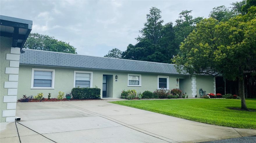 FULLY FURNISHED 2 BED/2 BATH/1 CAR CARPORT VILLA IN SEVEN SPRINGS GOLF & COUNTRY CLUB - AVAILABLE FOR THE 2026 SEASON!!! Beautifully furnished and updated. 2 bedroom, 2 full baths!  Nearly 1,200 sq ft.  Gorgeous kitchen with stainless appliances, granite countertops, tons of cabinets, a coffee/tea station and tons of light truly makes this the heart of the home.  Stackable W/D in kitchen closet for convenience! The large living and dining area are well appointed and have all the things you'll want for a comfortable stay.  The master bedroom is roomy even with the queen bed with a smart work station, walk in closet, oversized master bath with walk in shower! Use the sliding glass doors to go out to the enclosed Florida room.  You can access the peaceful brick patio out back, overlooking the 15th hole tee box of the executive golf course! This property is located in the lovely, gated golf course community! Just minutes from great shopping and Trinity hospital.  Less than one hour to Tampa and Busch Gardens or the famous beaches of Clearwater, Caladesi, Honeymoon Island and St. Petersburg.  Rent includes water, sewer, trash, cable, internet and electric.  It does NOT include the Social Membership. Security deposit of $500.  Tenant application of $40/each and HOA application with $150 fee are required.  There is a $150 cleaning fee.  Landlord prefers non smokers and no pets.