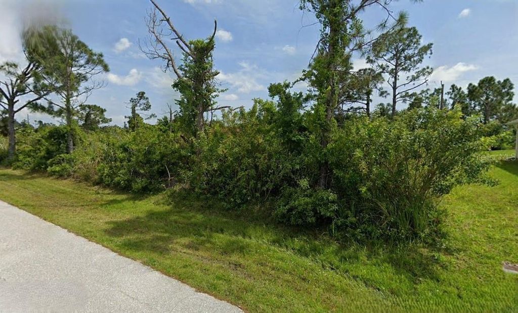 Photo of 12231 Zittle Avenue, Port Charlotte, FL 33981 (MLS # O6262661)