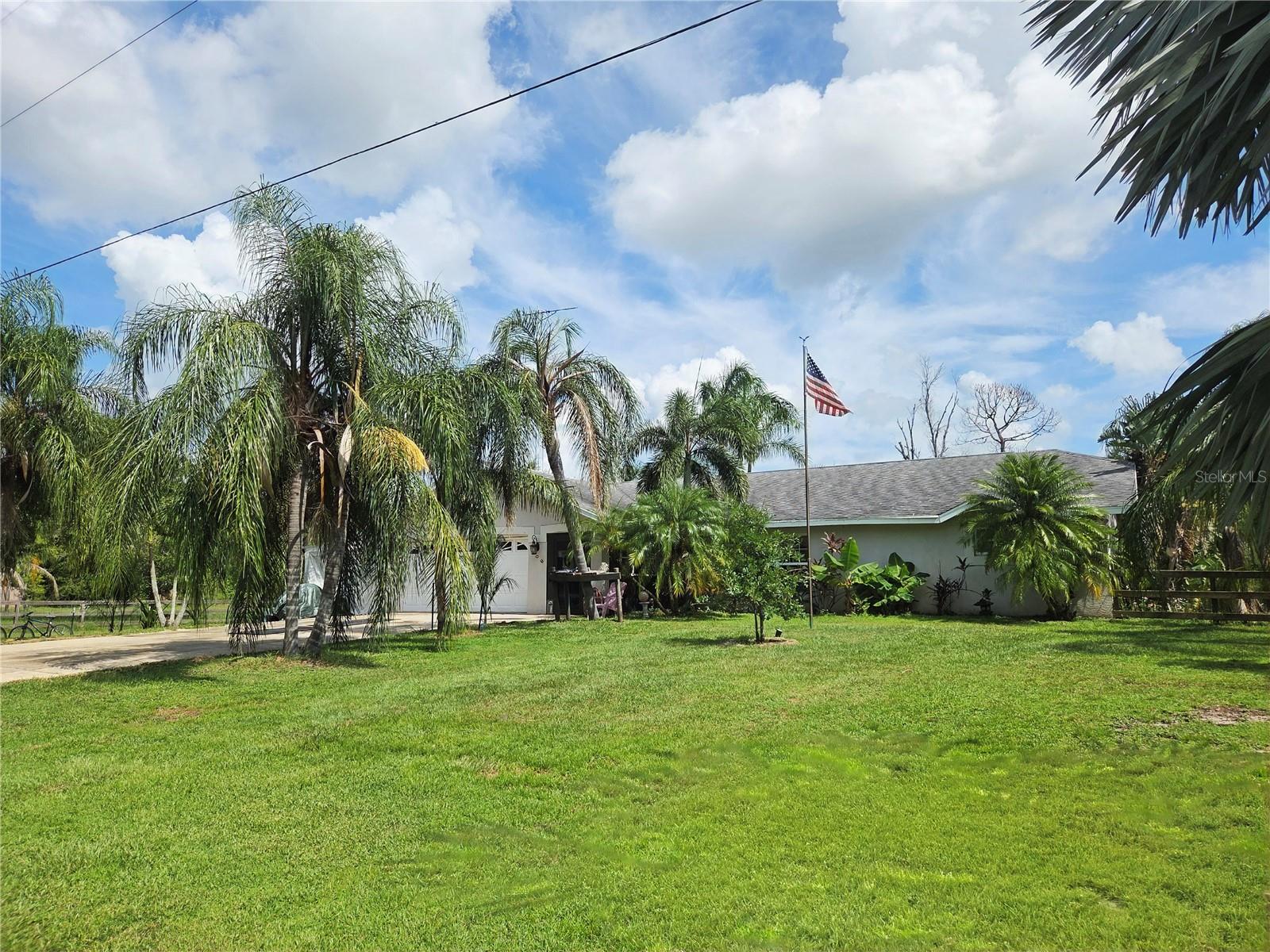 BEAUTIFUL COUNTRY SETTING!! Lots of UPGRADES - brand new solid wood doors (2024), all new hurricane-rated windows with colonial crate (2023 & 2024), plumbing updated to PVC pipes, water heater replaced in 2022, new water softner, brand new bathroom (2022), brand new kitchen (2022), and front & back porch screened in (the back porch includes new windows (2025) and new door). Come see this lovely 3 bedroom, 2 bathroom home nestled on 3 parcels for a total of 6.77 acres of picturesque land. Enjoy outdoor activities, gardening, or simply relaxing in this expansive setting. The property boasts a 2-stall barn, ideal for horse lovers or hobby farmers, an EXPANSIVE Florida room, and a serene pond, adding to the tranquility and beauty of the land. The home extends to nearly 1600 square feet of living space, providing a cozy yet spacious atmosphere featuring a LARGE living room with a Vaulted Ceiling, a formal dining room, and a brand new large kitchen. The kitchen presents gorgeous countertops, a charming backsplash, ample cabinets for storage, and stainless steel appliances. The bedrooms are generously sized, offering plenty of comfort for the whole family. The primary suite features privacy and separate access to the Florida room. Located just far enough from the hustle and bustle, but still within easy access to amenities. This is ready for your farm animals, ATV's and more! Schedule your appointment today and make this home yours!
