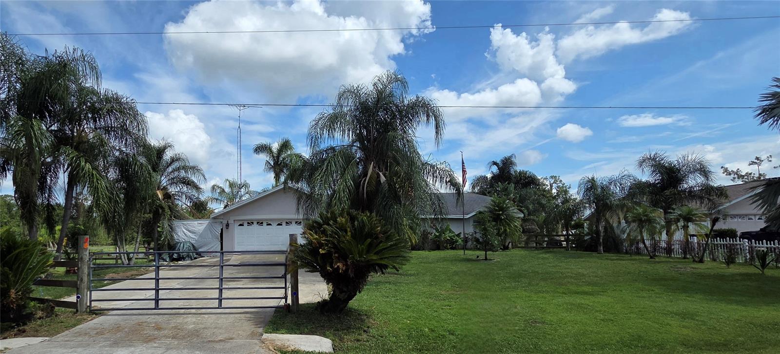 BEAUTIFUL COUNTRY SETTING!! Lots of UPGRADES - brand new solid wood doors (2024), all new hurricane-rated windows with colonial crate (2023 & 2024), plumbing updated to PVC pipes, water heater replaced in 2022, new water softner, brand new bathroom (2022), brand new kitchen (2022), and front & back porch screened in (the back porch includes new windows (2025) and new door). Come see this lovely 3 bedroom, 2 bathroom home nestled on 3 parcels for a total of 6.77 acres of picturesque land. Enjoy outdoor activities, gardening, or simply relaxing in this expansive setting. The property boasts a 2-stall barn, ideal for horse lovers or hobby farmers, an EXPANSIVE Florida room, and a serene pond, adding to the tranquility and beauty of the land. The home extends to nearly 1600 square feet of living space, providing a cozy yet spacious atmosphere featuring a LARGE living room with a Vaulted Ceiling, a formal dining room, and a brand new large kitchen. The kitchen presents gorgeous countertops, a charming backsplash, ample cabinets for storage, and stainless steel appliances. The bedrooms are generously sized, offering plenty of comfort for the whole family. The primary suite features privacy and separate access to the Florida room. Located just far enough from the hustle and bustle, but still within easy access to amenities. This is ready for your farm animals, ATV's and more! Schedule your appointment today and make this home yours!