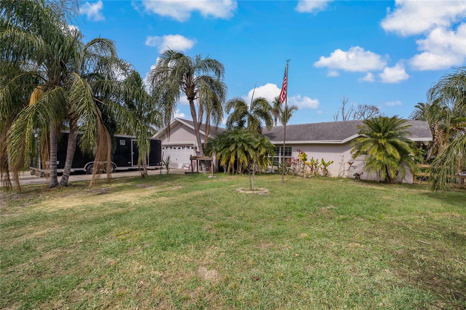 BEAUTIFUL COUNTRY SETTING!! Lots of UPGRADES - brand new solid wood doors (2024), all new hurricane-rated windows with colonial crate (2023 & 2024), plumbing updated to PVC pipes, water heater replaced in 2022, new water softner, brand new bathroom (2022), brand new kitchen (2022), and front & back porch screened in (the back porch includes new windows (2025) and new door). Come see this lovely 3 bedroom, 2 bathroom home nestled on 3 parcels for a total of 6.77 acres of picturesque land. Enjoy outdoor activities, gardening, or simply relaxing in this expansive setting. The property boasts a 2-stall barn, ideal for horse lovers or hobby farmers, an EXPANSIVE Florida room, and a serene pond, adding to the tranquility and beauty of the land. The home extends to nearly 1600 square feet of living space, providing a cozy yet spacious atmosphere featuring a LARGE living room with a Vaulted Ceiling, a formal dining room, and a brand new large kitchen. The kitchen presents gorgeous countertops, a charming backsplash, ample cabinets for storage, and stainless steel appliances. The bedrooms are generously sized, offering plenty of comfort for the whole family. The primary suite features privacy and separate access to the Florida room. Located just far enough from the hustle and bustle, but still within easy access to amenities. This is ready for your farm animals, ATV's and more! Schedule your appointment today and make this home yours!