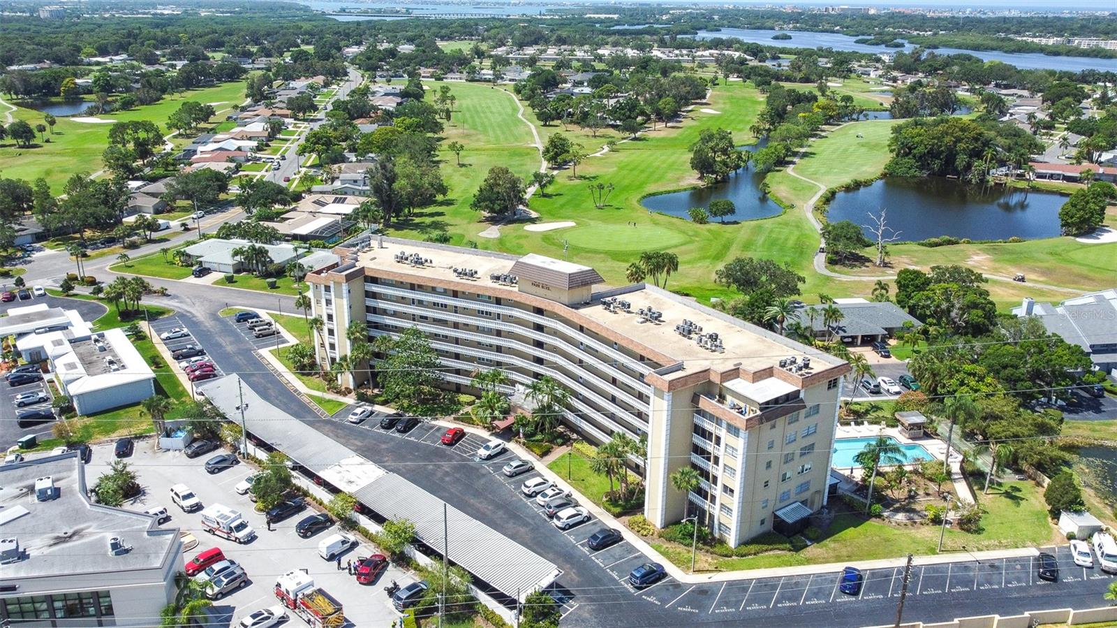 Beautiful Remodeled 2 bedroom, 2 bathroom, condo with no age restrictions! Sixth floor, highly desirable end unit, large and open, this unit has fantastic livable space! Large picture windows allow lots of light while keeping quiet, and secure. Gorgeous views of the pool and golf course from the living room and master bedroom. Both bedrooms have walk-in closets! Fully updated kitchen wood cabinetry, new granite countertops, and new appliances. Both Bathrooms totally remodeled with Carrera Marble, new tile and Kohler products. Beautifully stylish tile throughout the unit. The additional front room can be used as an office or den. Unit also includes a separate storage area. Community includes a heated pool, remodeled clubhouse area with full kitchen , pool table, and workout room. Private assigned Parking is in front with an available covered Carport for $12./ month payable to HOA. This unit is 5 miles to the beach, and overlooks the beautiful golf course of Seminole Lakes Country Club. Centrally located to shoppes, dining, and banking! This is a very easy unit to see .Call to schedule your showing today... LISTING AGENT IS TRUSTEE OF PROPERTY AND RELATED TO THE TRUST.