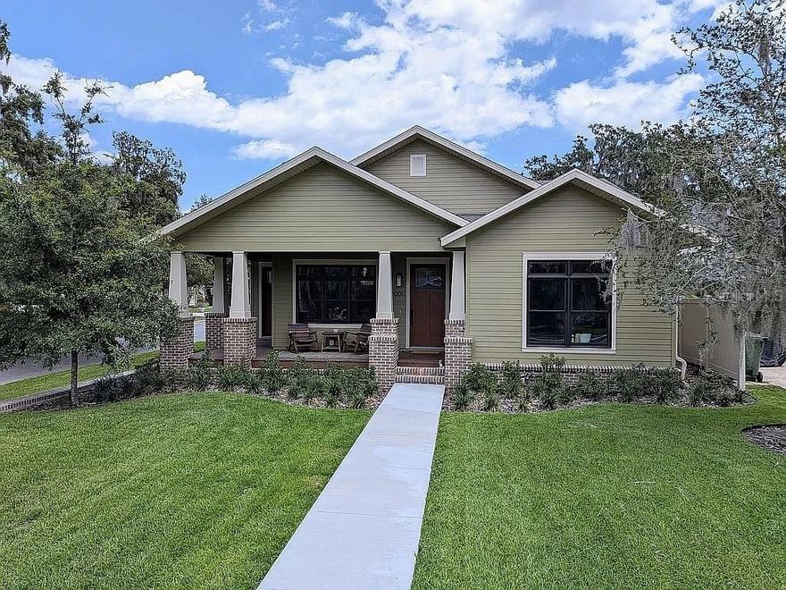 Welcome home to your completely custom house located in the heart of Leesburg's most historic and sought after neighborhood, Palmora Park. This home was built new 2024 and boasts a historic craftsman charm with all the modern finishes. The home sits high on the lot, surrounded by a hand laid brick wall, giving it a classical feel. The front and back porches will welcome your guests, while the open floor plan makes it easy to entertain them. Discover hardwood floors throughout, with marble tiling and quartz counters in all the bathrooms. The inside is accented with solid red oak doors and trim, as well as stained glass and hand painted tiles. The oversized two car garage has extended ceilings for extra storage space and an attic. The Anderson windows are custom stained to match the floor and doors, and the custom cabinet layout provides plenty of room for cooking and entertaining. A gas-assisted wood burning fireplace provides the perfect setting for parties, especially around the holidays. A gas 5 burner range and under counter microwave drawer provide all the tools necessary for a perfect meal. Make this house your home in Palmora Park!