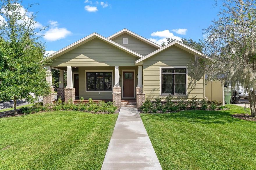 Welcome home to your completely custom house located in the heart of Leesburg's most historic and sought after neighborhood, Palmora Park. This home was built new 2024 and boasts a historic craftsman charm with all the modern finishes. The home sits high on the lot, surrounded by a hand laid brick wall, giving it a classical feel. The front and back porches will welcome your guests, while the open floor plan makes it easy to entertain them. Discover hardwood floors throughout, with marble tiling and quartz counters in all the bathrooms. The inside is accented with solid red oak doors and trim, as well as stained glass and hand painted tiles. The oversized two car garage has extended ceilings for extra storage space and an attic. The Anderson windows are custom stained to match the floor and doors, and the custom cabinet layout provides plenty of room for cooking and entertaining. A gas-assisted wood burning fireplace provides the perfect setting for parties, especially around the holidays. A gas 5 burner range and under counter microwave drawer provide all the tools necessary for a perfect meal. Make this house your home in Palmora Park!