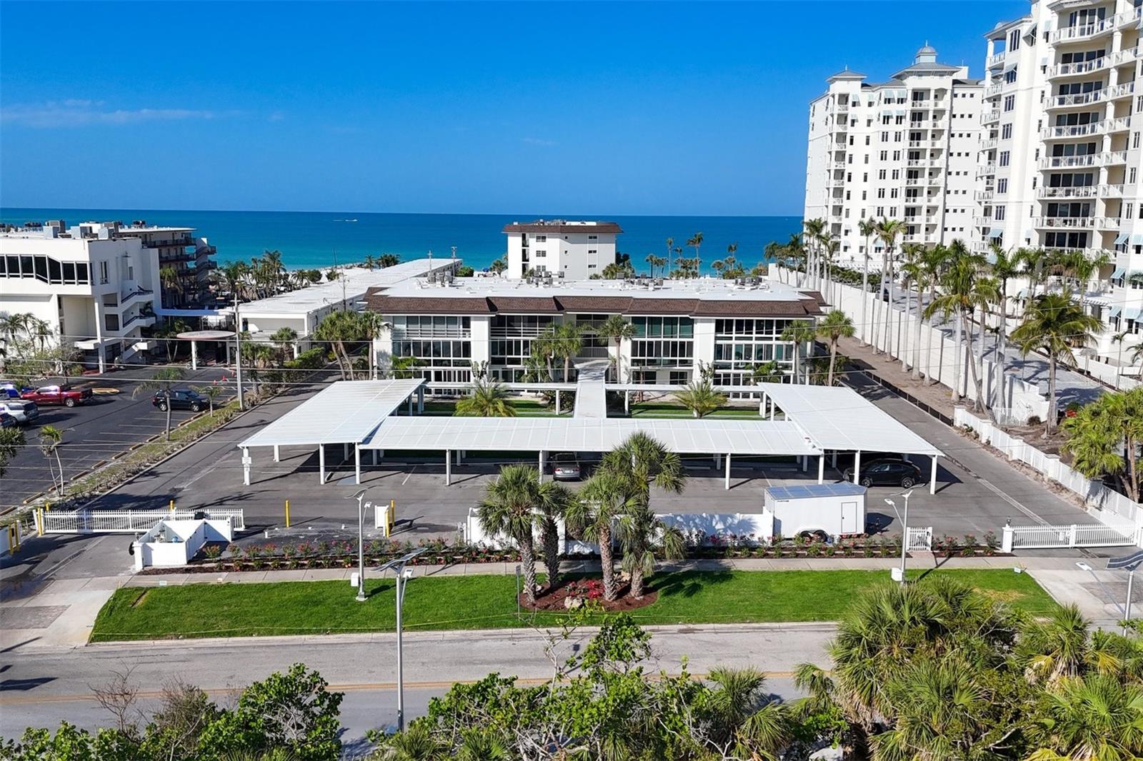 A unique opportunity to create a slice of Heaven. A first floor walkout with beach, sunset and garden views. Enjoy the white sandy beach, aquamarine water, and glorious sunrise and sunsets from this beach location. Over 1150 square feet of living space in this one bedroom plus den, two bath condo. This highly sought after great room floor plan allows this to live larger than one would think. The unit has had damage from the recent hurricanes. It will be turned back to a white box. The balance of the insurance money will be credited to the buyer. It has one covered parking space, a storage unit on the second floor in the building and a large lanai storage closet. Lido Harbour South is a beachfront complex with heated pool. The association is in process of restoring the property.