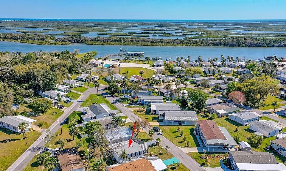 Don't miss this incredible opportunity to own a charming 2-bedroom, 2-bathroom mobile home in Terra Mar Village! Imagine enjoying the Florida sunshine on your private screened-in porch, perfect for relaxing with a morning coffee or unwinding after a long day.
This home offers comfortable living with two well-sized bedrooms and two full bathrooms. But the true gem of this property is its unbeatable location! Just a short stroll away, you'll find yourself at the picturesque river and community boat pier, offering easy access to boating, fishing, and enjoying the beautiful waterfront.