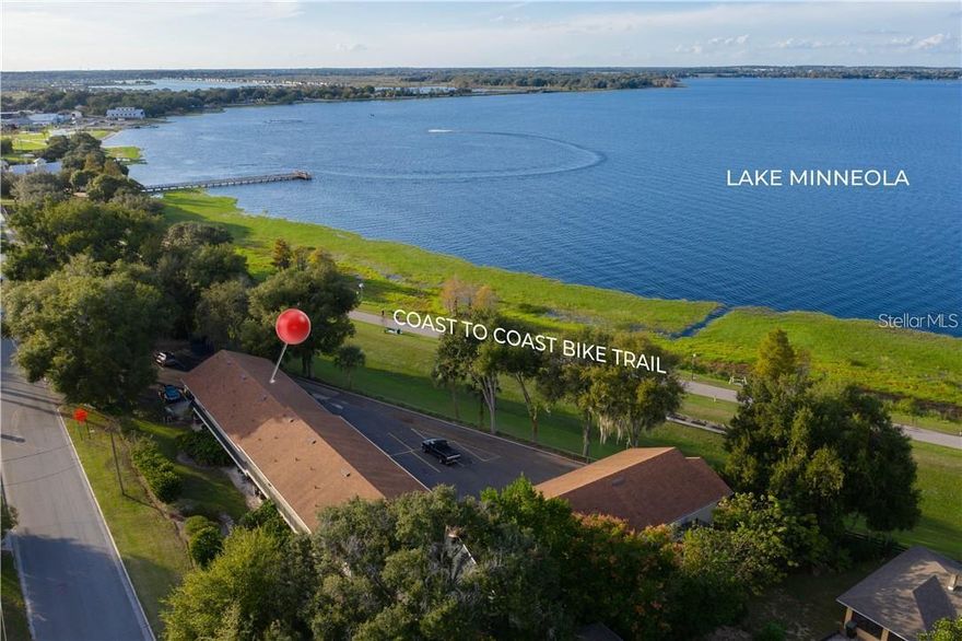 This affordable Lake Front, 2/2 condo is in the perfect location of Historic Downtown Clermont. Whether you are a snowbird looking for budget friendly Lake front or an Athlete wanting your own training grounds, or a new home buyer who can use for an investment when your family grows and you move up in size, this condo is perfect! Enjoy this Lake Front living on Lake Minneola and the Clermont Chain of Lakes. The West Coast Bike and Hiking Trail, also known as the Coast-to-Coast Trail is right outside your door. The views of the lake and trail from this first-floor corner unit will constantly inspire you!
It is the perfect size, with modern updates, newer windows and flooring, updated kitchen with a custom pantry you will love! What could be more fun than the easy walk to restaurants, shopping, breweries, the fun, the festivals, and never worry about parking. Live your best life as part of this downtown community.