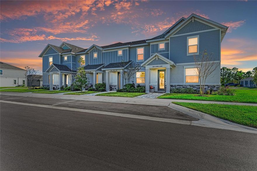 Discover one of Nautique’s most beautifully updated townhomes, offering a rare combination of elevated finishes and direct water views of Kingfisher Lake. 
Perfectly situated just a short stroll from the shops, restaurants & community events of Waterside Place, this home captures the essence of lakeside living. Every detail has been thoughtfully selected and upgraded beyond the builder’s offerings to create a truly model-home feel.Bright and airy, the home offers a wonderful sense of calm and balance throughout. The first floor features an open layout with 9-foot ceilings, designer pendant lighting, and a seamless connection between the living area and gourmet kitchen, with direct water views. The kitchen is a true showstopper, showcasing quartz countertops, a coordinating backsplash, upgraded KitchenAid appliances, and a spacious walk-in pantry. Luxury vinyl plank flooring extends throughout the home, complemented by new baseboards and moldings for a refined modern finish. Upstairs, the expansive primary suite overlooks the water and includes a California Closets system, custom blackout shades, and an en-suite bath. Two additional bedrooms, each with custom closets and roll down shades, share a well appointed full bath. Additional features include an LG washer and dryer in the laundry room, new powder room vanity, extra recessed lighting and an epoxy-finished garage floor. 
Unwind in the private screened-in courtyard, an ideal spot for morning coffee, lounging in the sunshine, or quiet evenings outdoors. Impact windows and doors offer added peace of mind, while the HOA includes lawn care and some of the most affordable fees in all of Waterside for truly low-maintenance living.
Residents of Nautique enjoy a community pool overlooking Kingfisher Lake, pickleball courts, a playground, and a dog park, all connected by miles of walking trails. Just minutes from downtown Sarasota and the Gulf beaches, yet walkable to the vibrant heart of Waterside Place, this home blends convenience, style, and lifestyle in one exceptional package.