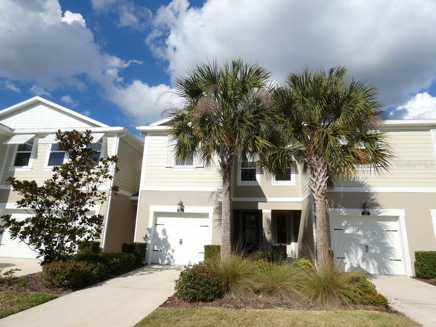 This beautiful townhouse (NEVER FLOODED) is located in the highly desirable waterfront gated community of Bayside Terrace. The home offers three bedrooms and two and a half bathrooms with a modern, open layout designed for comfortable living and entertaining. The 9 foot ceilings enhance the spacious feel and allow natural light to flow throughout the home. There is no immediate rear neighbor, providing added privacy and a more open feel from the lanai. Grilling is allowed in the backyard area, giving you the ability to enjoy outdoor cooking and entertaining. The home has been meticulously kept and shows true pride of ownership. It also includes a private 1 car garage for secure parking and additional storage. Upon entering, you immediately notice the ultra-modern feel and the exceptionally well-maintained condition of the property. The spacious kitchen features an extra-large island that is so generously sized it feels like it has its own zip code, along with an under-mount sink, quartz countertops, stainless steel appliances, and a walk-in pantry. The main living area has tile flooring throughout, creating a clean and seamless look, and opens to a screened-in lanai with brick pavers for easy indoor and outdoor living.  Upstairs, the upgraded Berber-carpeted staircase with elegant railing leads to a loft area and all bedrooms. The primary suite is generously sized and includes multiple walk-in closets and a beautifully designed en-suite bathroom. Bedrooms two and three each feature carpeting and their own walk-in closets, offering excellent storage and flexibility.  The home also includes hurricane shutters stored in the garage, providing added storm protection and peace of mind.  Bayside Terrace offers resort-style amenities including a waterfront infinity heated salt-water pool, a covered pavilion overlooking the water, a cabana, two BBQ grills, a gas fire pit, a fitness center, clubhouse, and a dock with kayak and canoe launch access. The gated entrance and deed restrictions add an extra layer of privacy and security, while the waterfront setting allows residents to enjoy Florida sunsets and an active coastal lifestyle.  Please view two videos: Tour 1 & Tour 2.