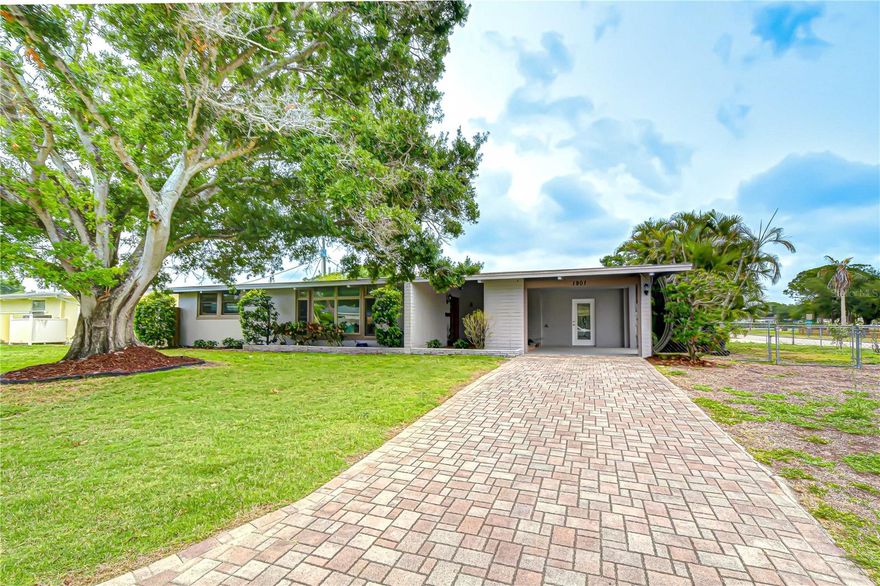 Welcome to 1901 Oxford St N, St. Petersburg, FL — a beautifully maintained Mid-Century Modern ranch offering timeless character and an unbeatable location. 

Inside, you’ll find original terrazzo flooring throughout most of the home, delivering both durability and classic Florida charm, while tile flooring in the kitchen and bathrooms adds practicality where it matters most. The bright and open layout is filled with natural light, and the spacious kitchen features ample cabinetry, modern appliances, and a functional design perfect for everyday living and entertaining.

Step outside to your private, fully fenced backyard retreat, complete with a sparkling in-ground pool and patio space ideal for relaxing or hosting guests. It’s the perfect setting for enjoying Florida’s year-round sunshine ??

Conveniently located near shopping, dining, and everyday essentials, this home also offers quick access to major roadways. Plus, you’re just a short drive from St. Pete’s renowned Gulf beaches and vibrant downtown, giving you the best of coastal living and city convenience.