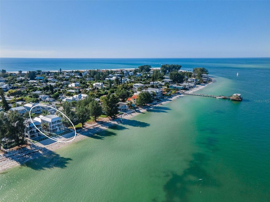 The Ultimate Beach Front Paradise on Anna Maria Island where the stunning panoramic views of the bay will captivate you while you enjoy your own private beach! The rental income on this property is outstanding with over $545k in ’22 and $531k in ’23 and $500k already booked for 2024. The location doesn't get any better as it located directly on the bay, in the desirable north end of Anna Maria Island and only steps away from the Rod & Reel Prier and Bayfront Park. Enjoy viewing dolphins and manatees without leaving the home! The popular Bean Point and Pine Street are just a short walk away. The numerous upgrades and amenities of this 4 Bedroom / 4.5 Bathroom home are also what make this property the pinnacle of AMI rental potential and luxury. Each bedroom includes an ensuite bathroom and is marvelously themed capturing the spirit of Anna Maria Island. Two of the King Bedrooms are Bayfront, complete with balcony access to capture the picturesque sunrises and breathtaking views of the illuminated Sunshine Skyway Bridge at Night. Three of the Bedrooms have King Beds and the fourth bedroom includes a ship themed bunk bed system that consists of 2 twin and 2 queen beds. The kitchen is equipped with top of line appliances such as sub-zero and wolf and has a large island complete with 4 barstools and topped with a beautiful Cambria stone that waterfalls over each end. The patio features a commercial grade bar with 3.5 inch concrete countertops, nautical pilings, under the cabinet ice machine and refrigerator. A nautical designed swinging bed has room for a few and is perfectly placed to relax, take a nap and enjoy the bay breeze. Patio entertainment is complete with a 6-speaker Sonos outdoor system, Sunbrite outdoor rated TV and foosball table. The over 500 square feet of pool/hot tub and 3-hole putting green complete the outdoor utopia.