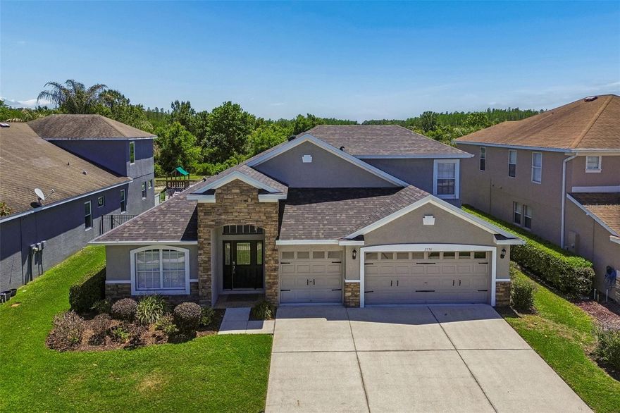 Stunning curb appeal and offering nearly 3,400 sq ft, this impeccably maintained home features 5 bedrooms, 4 baths, an office/den, an upstairs bonus suite, and a 3-car garage, situated in the desirable Meadow Pointe III community and zoned for Double Branch Elementary, John Long Middle, and Wiregrass Ranch High, this home blends casual elegance with a serene pond with wooded conservation views.


As you enter the foyer, it opens to a welcoming living area and French doors to a flex office or could be used as a 6th bedroom. An arched opening leads to the formal dining room, highlighted by a custom built-in cabinet with a granite top that creates a stunning serving and display area for entertaining. The gourmet kitchen is the heart of the home and is designed for both function and style. Enjoy warm 42" wood cabinetry with pull-out drawers, gleaming counters, an island breakfast bar, stainless steel appliances and pantry closet. The kitchen flows seamlessly into the large great room/family room with newer LVP flooring and an adjacent breakfast nook, creating an open-concept layout perfect for everyday living and gatherings. Separate formal living and dining rooms provide additional options for hosting guests. 


The primary suite is conveniently located on the main level and features beautiful LVP flooring and peaceful views of the wooded conservation area. The en-suite bath includes dual sinks, solid-surface counters, a garden tub, and a large separate walk-in shower. Secondary bedrooms and baths on the main floor offers flexibility for family, guests, or multi-generational living. Upstairs, an impressive bonus room, private 5th bedroom, and full bath create an ideal guest suite, media room, or teen retreat. This upper-level space adds valuable extra living area while maintaining privacy from the main level. 


Outdoor living shines with a spacious fenced backyard and a screen-enclosed lanai space ready for a future outdoor kitchen or pool. Relax on the back lanai and enjoy the natural setting, privacy, and tranquil conservation views.Meadow Pointe III offers a full array of amenities, including a clubhouse, resort-style swimming pool, splash zone, fitness center, tennis, basketball, and shuffleboard courts, as well as multiple playgrounds. The community is conveniently located near I-75 and I-275, shopping, restaurants, medical facilities, The Shops at Wiregrass, Tampa Premium Outlets, and more.