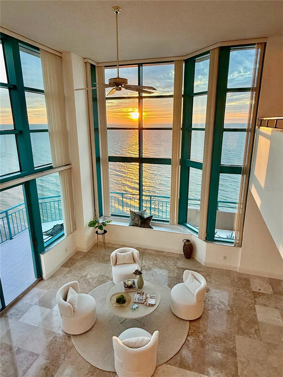 Rare TWO-STORY BEACHFRONT PENTHOUSE – Panoramic Sunset Views, Stunning Updates & Hurricane-Resilient Design...This exceptionally rare, two-story beachfront penthouse at ULTIMAR One has been brilliantly refreshed and elevated, offering an unmatched combination of modern elegance, Gulf-front panoramas, and peace of mind with solid concrete construction. Occupying both the 19th and 20th floors, this premier penthouse residence offers an expansive layout on the top of this southwest-facing masterpiece. From the moment you enter, breathtaking Gulf views unfold, with every room opening to impressive balconies that create an ever present connection to the water. These expansive wraparound terraces create the sensation of floating above the shoreline — perfect for entertaining, relaxing, and soaking in the serenity of the sea with the sound of the waves. Living at Ultimar is more than a mark of prestige — it’s the realization of your dream coastal lifestyle. Here, every day feels like a vacation, and every moment a reminder that you’ve arrived at the pinnacle of beachfront living. Inside, upscale new updates including floors and elegant bathrooms have transformed this residence into a turnkey showcase of coastal luxury. The grand two-story living space is framed by soaring ceilings and walls of glass, with a dramatic curved staircase that serves as the architectural centerpiece. The contemporary kitchen pairs rich cabinetry with sleek dark granite, opening to a casual dining area with sweeping Gulf views. The formal dining room offers an elegant setting with beach vistas as your backdrop. The first level also features a versatile first guest bedroom (ideal as an office), a new elegant bathroom, and a gracious guest suite (or second primary) with oversized walk-in closet and expansive walk-in shower — all refreshed to reflect a sophisticated design with a spacious layout. Upstairs, an open loft / media lounge overlooks the living room and opens to a private upper balcony. The primary suite is a true sanctuary, with dual custom walk-in closets and two indulgent, spa-inspired bathrooms featuring soaking tub, walk-in showers, and resort-quality finishes. A semi-private elevator delivers you directly to your penthouse door, and a private two-car garage with additional storage located just steps from the elevator for unmatched convenience. As part of the exclusive Ultimar community, residents and guests enjoy an elevated lifestyle with three resort-style pools, whirlpool spas, tennis courts, a state-of-the-art fitness center, billiards room, plenty of parking, and private beach access — all just steps from the sugar-white sands of Sand Key.
Minutes from Clearwater Beach and Belleair, and only 30 minutes from Tampa International Airport, this residence offers a rare blend of seclusion, sophistication, and security.
This move-in-ready, newly updated two-story penthouse is more than a home — it is a statement of coastal luxury, a lifestyle realized, and one of the most sought-after residences on Florida’s Gulf Coast.