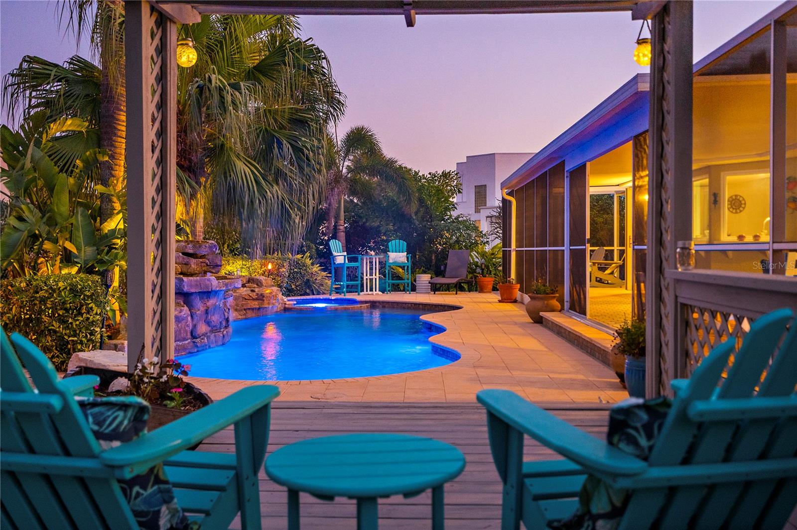 Your key to the island lifestyle is right here on an oversized corner lot in the desirable Monte Cristo neighborhood on the island paradise of Tierra Verde. This home was high and dry and completely undamaged from Helene and Milton.
The indoor living here is exceptional, with light, bright, and cheery interior spaces in a split floor plan, and the outdoor living is unparalleled, with a giant screened porch opening onto a backyard pool area that is nothing short of a private oasis.
Gorgeous waterfalls cascade into a tremendous sparkling saltwater pool, self-cleaning and magnificent, with an inviting spa, plus a sun shelf and bench, for perfect in-water entertaining. The sprawling pool deck is surrounded by multiple outdoor gathering spaces, including a bar and a built-in barbeque area, truly your personal tropical sanctuary. In addition to the outdoor living and entertaining areas, there is also a very sizable side fenced yard, so pets or avid gardeners can have their own slice of paradise, as well.
When you walk through the front door, you are greeted by a spacious great room, boasting a shellstone-clad fireplace, vaulted ceilings, and a view through the pocketing sliders out to the rear oasis. The bright and airy kitchen also opens on the back patio for exceptional entertaining and features high ceilings, a skylight, an eating area, and plenty of room for an island, should you want to add one, and two of the three bedrooms open to patio with views of the pool as well.
In the master you’ll find a spacious suite with a walk-in, frameless shower, dual vanities, and an impressive walk-in closet, while in the other poolside bedroom at the other end of the home features plenty of space and shares the surprisingly stylish guest bath with the third bedroom, currently configured as an office.
The two-car garage has a great deal of workspace and room for the toys that make island living so much fun. The home has impact-rated windows, and newer, well-maintained systems throughout, and the meticulous care the owners have taken is apparently in every corner. In addition, the flood insurance policy on this home is currently less than $900 per year and is assumable.
The island of Tierra Verde is one of the sought-after communities in Tampa Bay, being perfectly located on the Pinellas Bayway between mainland St. Petersburg and the white sands of the Gulf Beaches. Surrounded by supreme boating water and stunning views, the island offers an unmatched lifestyle, with 11 excellent restaurants right on the island, tennis courts, a playground, and a vibrant community, plus, Tierra Verde is the gateway to Ft. DeSoto, featuring miles of walking/biking/running/blading trails, award-winning pristine beaches, world-class kayaking, and so much more. Cross over the new bridge and you'll find the Isla del Sol Yacht and Country Club, and you'll be within minutes of historic Pass-a-Grille, St. Pete Beach, and endless Gulf-front fun. In the other direction you have super quick access to 275, putting the vibrancy of downtown St. Petersburg within a short drive, and you'll have quick access to multiple airports, including TPA, PIE, and SPG. Monte Cristo is a neighborhood ripe with multi-million-dollar homes and provides for tropical living in an elegant setting.