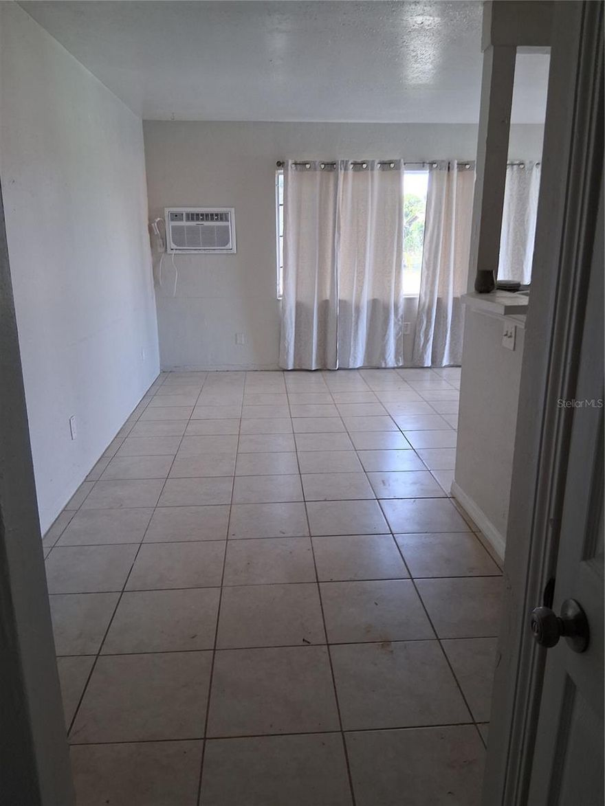 Come take a look at this 2 bedroom 1 bath 1/2 a duplex in St Petersburg. Home was freshly painted on the interior and ready for immediate occupancy. Tile throughout the home with a split bedroom floorplan. Large yard with parking in back off alleyway. Walking distance to St Pete College! Come take a look!!