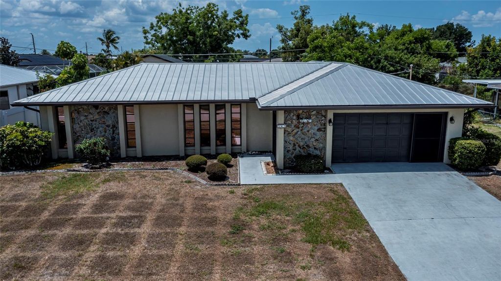 Photo of 543 Mayview Avenue NW, Port Charlotte, FL 33952 (MLS # TB8493641)