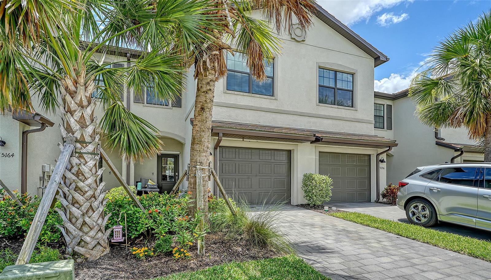Discover the essence of resort-style living at 15160 Lyla Terrace, nestled in the vibrant Lorraine Lakes community of Lakewood Ranch. This exquisite townhome, built in 2022, offers the perfect combination of modern elegance and comfort across two beautifully designed levels.
Step inside to a warm and inviting atmosphere where the living room, accented with an electric fireplace, upgraded lighting, and ceiling fans, serves as the perfect setting for relaxation and casual gatherings. The gourmet kitchen is a chef's dream, featuring sleek granite countertops, stainless steel appliances, and natural gas cooking to make meal preparation a joy.
The home boasts three spacious bedrooms and two full bathrooms on the upper level, along with a convenient half-bath on the first floor. The thoughtful design ensures functionality and style, while the covered lanai offers a serene spot to unwind and enjoy the pleasant Florida climate.
Socializing is a delight at the on-site restaurant and bar, making every day feel like a vacation. Living in Lorraine Lakes means access to a suite of world-class amenities designed to enhance your lifestyle. Enjoy resort-style features including a poolside bar & grill, resort style pool, fitness center, high intensity gym, indoor basketball court, clubhouse, splash pad, game room, playground, volleyball and more!
An attached one-car garage provides additional convenience and security, adding to the practicality of this impressive home.
Embrace the opportunity to live in a community that embodies the luxury and ease of resort living, with all the comfort and style you desire in a home.