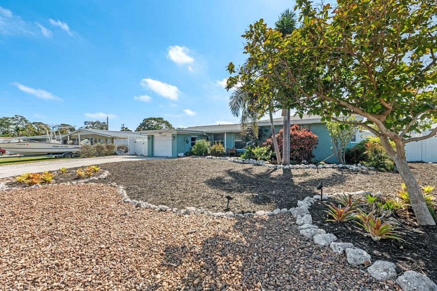 Experience the epitome of coastal living within Tropical Shores Community, Sarasota's most affordable boating community.  NO HOA/DEED RESTRICTIONS.  1728 Bayonne with been exquisitely remodeled and no expense was spared.   Modern conveniences abound within this 2 bedroom/1 bath POOL home including BRAND new A/C system, tankless water heater (2023), luxury-vinyl flooring and Terrazzo flooring throughout, new Kitchen Cabinetry/Countertops/Backsplash (2020), Samsung Bespoke appliances (2023), Deluxe window treatments (2023), built-in Dining Room storage cabinets (2023), outdoor shower installed (2020), tankless water heater (2023) and New Roof (2023).  Only a short walk away from the community’s private marina and clubhouse. Membership is optional but there is a boat launch that provides quick access to the bay by kayak, canoe or boat. Just minutes away from our #1 beach, Siesta Key, Sarasota Square Mall and fine restaurants. No HOA fees or any other fees. Neighborhood club membership allows members access to indoor/outdoor clubhouse facilities.  Boat/kayak ramp and boat slips available for nominal YEARLY fees.