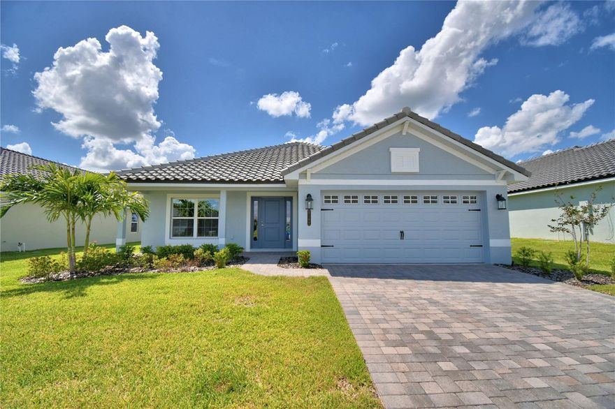 Under Construction. This thoughtfully designed approximately 2,200 sq ft home offers 4 bedrooms, 3 full baths, and a 3-car garage, delivering a layout that balances open gathering spaces with exceptional bedroom privacy. Upon entering, you’re welcomed into an open-concept great room, dining room, and kitchen with 10’ ceilings, wood-look plank tile in main living areas, granite countertops throughout, 5¼-inch baseboards, and wainscoting in the dining room, creating a polished yet comfortable living environment. One of the most desirable features of this floorplan is its ability to support multi-generational living. In addition to the primary owner’s suite, the home includes a secondary bedroom with its own private ensuite and walk-in closet, making it an ideal setup for an adult child, parent, grandparent, or long-term guest who values both independence and comfort. This thoughtful arrangement allows multiple household members to enjoy true privacy within the same home. The primary owner’s suite is spacious and inviting, featuring a tray ceiling with crown molding and a well-appointed ensuite with dual vanities with storage drawers, linen closet, separate tiled shower with glass enclosure, and a soaking tub. The remaining two bedrooms are also generously sized and share an oversized bath with double-sink vanity, storage drawers, linen closet, and a separate toilet and tub-shower area, offering both function and convenience. Notably, every bedroom in the home includes a walk-in closet, and three of the four bedrooms connect directly to a bathroom, a feature buyers often find both practical and rare. The exterior showcases a tile roof, paver driveway, and a paver-covered lanai, extending living space outdoors. Located in Lake Juliana Estates, residents enjoy a gated community with two entry gates, a gorgeous clubhouse with fitness center, pool overlooking the lake, basketball and tennis courts, playground, and a community boat ramp and dock. Convenient access to I-4 and the Polk Parkway makes commuting and travel easy. Buyers who choose this floorplan often appreciate how effortlessly it accommodates evolving household needs—offering flexibility, privacy, and comfort without sacrificing shared living space. It’s a well-planned home for those seeking functionality today and adaptability for the future.