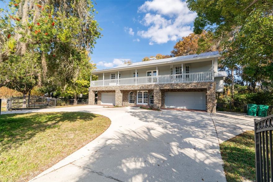 Experience unparalleled Luxury on the Rainbow River and discover Florida living at its finest! This stunning two-story, 6,040 sq. ft. riverfront estate offers unobstructed views of the crystal-clear Rainbow River—no homes across the water, just pure natural beauty. Designed to embrace its surroundings, the home features two expansive screened porches spanning each level, plus a private porch off the owner’s suite, perfect for morning coffee or sunset cocktails. Step inside through a grand foyer and ascend the elegant staircase or take the custom elevator to the upper level, where a spectacular great room awaits. Soaring vaulted ceilings, a stately fireplace, and a custom wet bar set the stage for entertaining. The open gourmet kitchen flows seamlessly into the dining area, while walls of glass and French doors invite you to the porch for panoramic river views. The owner’s suite is a serene retreat with a cozy sitting area, fireplace, and private porch. The spa-inspired bath boasts a walk-in shower, soaking tub, private water closet with bidet, dual vanities, and two walk-in closets. Two additional guest suites with private baths ensure comfort for family and friends. The ground floor boasts a spacious foyer leading to an impressive game room with a built-in bar and cabinets. There is also a large flex room, with a closet and utility sink - perfect for an artist’s studio, fitness room, home office, or additional guest suite. A nearby bedroom and full bath make this level ideal for multigenerational living. Two oversized garages easily accommodate four vehicles, and a large laundry room is conveniently located upstairs. Outdoor living is unmatched featuring a private deck leads to your dock for boating, kayaking, paddleboarding, fishing, and swimming. A tranquil waterfall feature completes this rare riverfront paradise. This exceptional property combines luxury, serenity, and the essence of Florida living! *All measurements to be verified by buyer and buyer's representative**