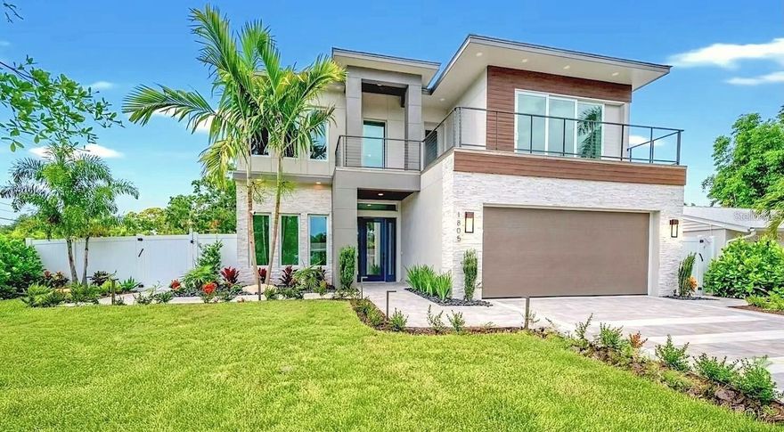 Nestled West of the Trail and just steps from Southside Village, this stunning New Construction 2-story luxury home offers the perfect blend of location, design, and lifestyle. Positioned between Siesta Key’s world-famous beaches and Downtown Sarasota, you'll enjoy easy access to the city’s best dining, shopping, and cultural attractions—all within minutes.

Designed with modern elegance, the home features 5 bedrooms, 5 full bathrooms, and 3,595 square feet of thoughtfully crafted living space. Additionally, there is a large bonus room for an office or gym, an upstairs second living room area, and several balconies to enjoy. From the grand 20-foot ceilings in the main living area to the floor-to-ceiling windows that flood the interior with natural light, every detail has been curated for style and comfort. Light-tone engineered hardwood floors flow throughout the home, with a herringbone pattern in the foyer. The gourmet kitchen is outfitted with GE Cafe appliances, quartz countertops, and custom cabinetry, flowing seamlessly into the open living and dining areas, with a wine display.

Step through glass sliding doors to discover a resort-style outdoor oasis, complete with a covered patio, outdoor kitchen, pool, and hot tub spa, all surrounded by lush landscaping. The first-floor primary suite offers a tranquil retreat with direct outdoor access, a spa-like bathroom, and a generous walk-in closet. Upstairs, three additional en-suite bedrooms and two rooftop decks provide privacy and space for guests or family.

This newly built residence offers peace of mind with the latest in building codes, energy efficiency, and storm protection. Modern insulation, impact-rated windows and doors, and up-to-date mechanical systems translate into lower utility bills, reduced maintenance, and enhanced safety. You’ll also benefit from turnkey readiness—no need for costly renovations or updates.

With its prime location, high-end finishes, and indoor-outdoor flow, this home captures the essence of luxury Sarasota living. Rarely do homes become available in this coveted neighborhood—this is your opportunity to own this exceptional property.