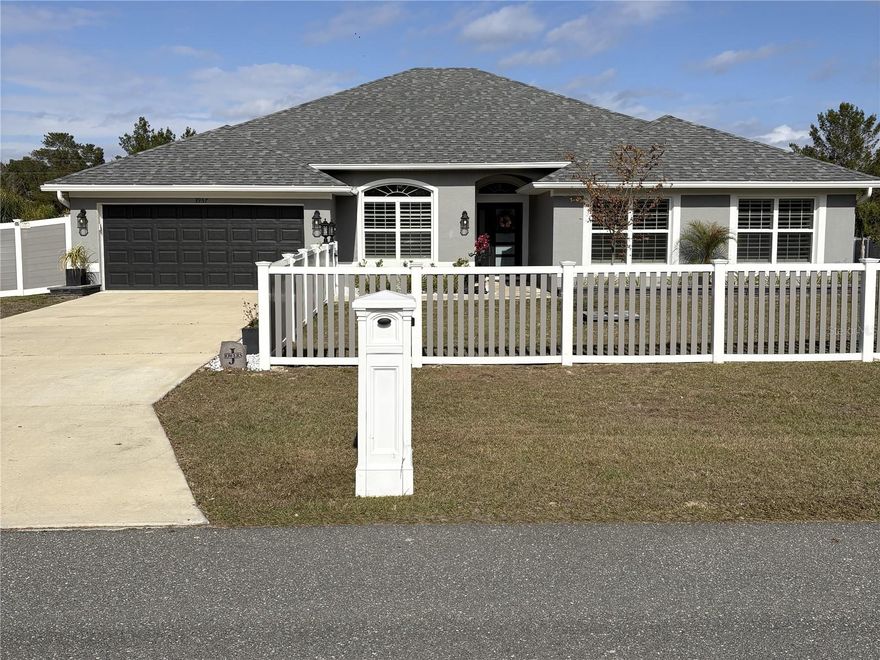 Absolutely spectacular 2-year-new pool home with extensive custom upgrades!
This stunning residence offers approximately 3,000 sq ft of living space with 4 bedrooms plus an office, 3 full bathrooms, and a 2-car garage, all situated on over a half-acre lot with NO HOA or CDD fees.
Luxury finishes abound, including 12x60 wood-look tile flooring throughout and custom window treatments on every window. The family and dining rooms feature soaring 13-foot vaulted ceilings and an electric fireplace, creating a dramatic yet inviting living space.
The open-concept kitchen is a showstopper, showcasing quartz countertops, black hardware, brick backsplash, floating shelves, a 36” freestanding stove, and a pot filler. Adjacent to the kitchen is a large walk-in pantry with added cabinetry, providing additional storage.
The spacious primary suite offers a true retreat with multiple walk-in closets, an electric fireplace, and a coffered ceiling. The ensuite bathroom features a soaking tub, separate shower, dual sinks, and a dedicated vanity area.
The office boasts 10-foot ceilings and beautiful green cabinetry, perfect for working from home. Three additional generously sized bedrooms and two additional full bathrooms complete the interior.
Outdoor living is just as impressive, featuring a 15x30 screened-in pool surrounded by pavers and a covered lanai ideal for outdoor dining and entertaining. The fully fenced and landscaped backyard, offering privacy and tranquility.
This exceptional home combines modern luxury, thoughtful design, and outdoor living - a rare opportunity with no HOA or CDD.