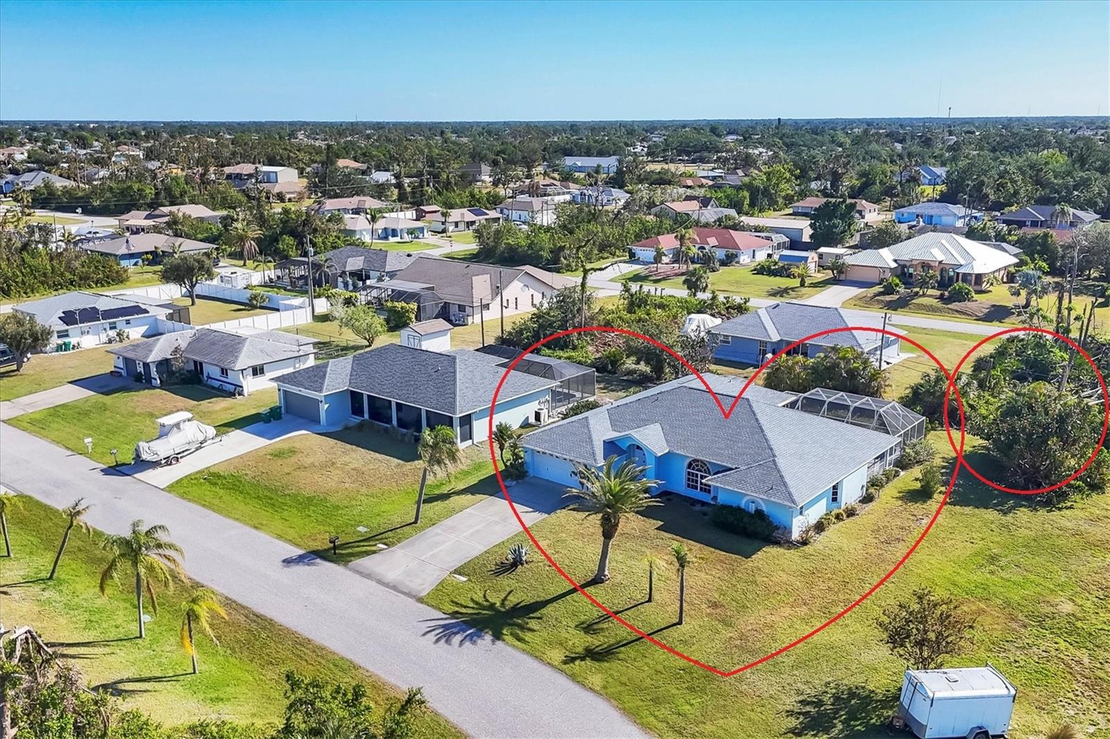 TWO LOTS ** PRIVATE WOODED VIEW (of your lot) ** NO FLOOD ZONE ** SCREENED IN POOL ** NO HOA or RESTRICTIONS ** LIVING ROOM and LARGE GREAT ROOM ** BIG COVERED PATIO ** WALK IN CLOSETS ** SHED ** ELECTRIC ROLL DOWN HURRICANE SHUTTERS in the BACK ** CLEAN LARGE & READY FOR YOU! Located in the popular beach town of ENGLEWOOD, FL, this SPACIOUS home is waiting for you! There’s plenty of elbow room in this 2300 sq foot single family home, with BOTH a LIVING room AND a FAMILY ROOM, LARGE KITCHEN with EXTENDED stone-top BREAKFAST BAR and DINETTE area that leads to the 13’ x 22’ covered LANAI and POOL area. There’s also plenty of room on the property because there are TWO LOTS included in this sale; the lot behind the home is part of this parcel! You can keep it for privacy or sell that off if you wish. This home offers the luxury of the popular “SPLIT FLOOR PLAN”, with the spacious primary suite on one side of the home and the 2 additional bedrooms and full bathroom on the opposite side. The primary suite, dining room, dinette/kitchen area and second bathroom all lead out to the pool area with a full screen enclosure. The sliding glass door in the kitchen area open the entire wall to the pool! That area also enjoys the start of a vaulted ceiling which extends into the family room area. Every room is expansive in this home, from the interior laundry room (with cabinets, a butler closet and utility sink) to the walk-in closets. It’s so open and bright that you don’t even need to turn a light on! The roof (2023), HVAC (2024), front door and electric roll down hurricane shutters along the lanai are all 2 years old. And did we mention X FLOOD ZONE? That means no flood insurance is required so you don’t have that extra expense. This home is not in a deed-restricted community, so you have no additional association fees, and you ARE allowed to store things in your shed (included). Located in a beachgoer, boater and sun-lovers’ community, close to the beaches, boat ramps, golf courses, medical offices, and shopping. Come enjoy paradise!