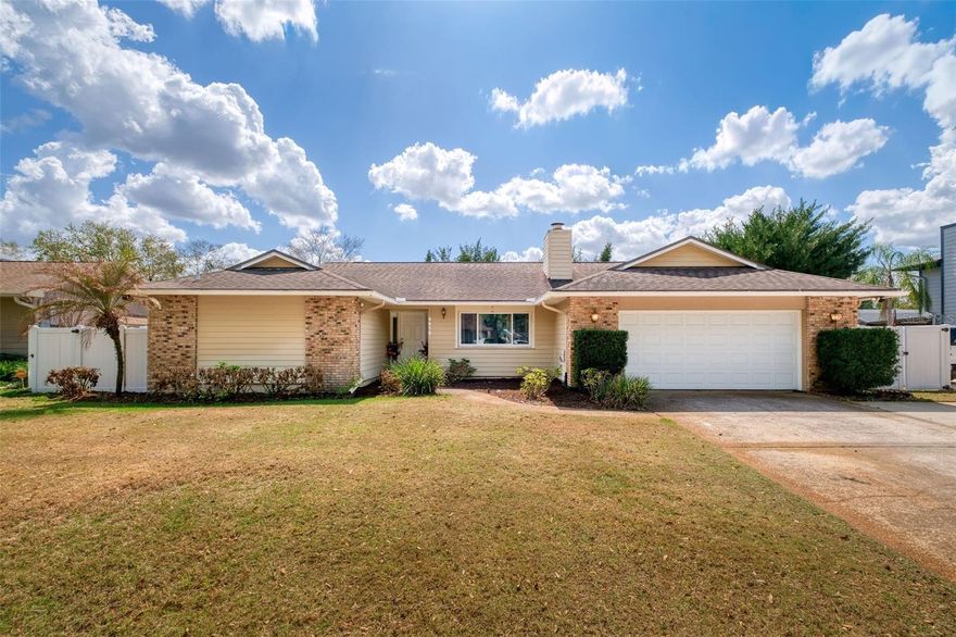 This abode has it all! Beautiful and updated with 4 bedrooms, 2 baths, screened-in pool, covered lanai, over 2,000 sq ft interior living space, and zoned for Winter Park High. NEW ROOF being put on before closing! Stepping inside, the welcoming foyer showcases the split bedroom plan with the secluded primary bedroom off the living and dining rooms. The en-suite includes granite topped double sink vanity and large tiled shower; and the big walk-in closet (5’x8’) has custom wood built-in shelving. 
While large ceramic floor tile runs throughout most of the house (no carpeting anywhere), the spacious living and dining rooms offer hardwood bamboo flooring along with french doors leading out to the covered lanai, entertaining space, and pool. Through the family room with its soaring vaulted ceiling and wood burning fireplace is the heart of the home: the large open kitchen. Loads of granite countertop space offers plenty of room for meal prep and a generous amount of storage can be found in the solid wood cabinets (new stainless-steel dishwasher and microwave 2025 and fridge 2024), including a built-in wine fridge in the island. All 3 other bedrooms and a hall bath, with a double sink granite topped vanity and jetted spa tub/shower combo, are on this side of the home. 
Enjoy time with family and friends on the huge lanai (14’x36’) with ceiling fans and room for grilling up poolside burgers and hot dogs. And there is still tons of green grassy space in the fully fenced backyard for pets and activities. Updates: NEW HVAC 2023, NEW hot water heater 2022, NEW double pane windows 2018, NEW garage door and opener 2018, NEW fencing 2018.  Woodside Village offers so many community features: private boat ramp on Lake Pearl, the residents only lakeside pool, playground for the kids, and tennis/pickle ball courts. Zoned for sought after and highly rated Lakemont Elem, Maitland Middle, and Winter Park High. Come live the lifestyle you’ve always wanted at 8878 Larwin Lane.