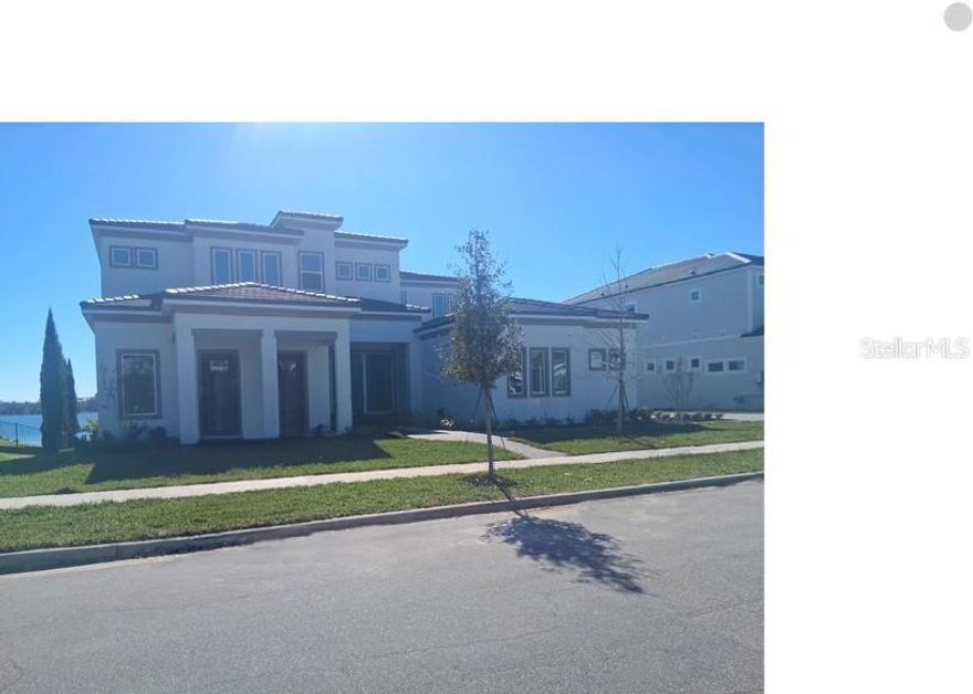 Exquisite Luxury Estate in Shorefront Cove at Horizon West. Presenting a rare opportunity to own a premier residence in the sought-after Shorefront Cove community of Winter Garden’s Horizon West. This elegant two-story estate offers 6,442 square feet of impeccably designed living space, showcasing refined luxury, modern convenience, and breathtaking views of Huckleberry Lake. Boasting 6 spacious bedrooms, 6 full bathrooms, and 2 half baths, this home features dual primary suites, one on the main level and one on the upper level, bonus room, wet bar, theater, large lanai, and 4-car garage offering ample storage and convenience. This residence provides easy access to major highways, premier shopping, dining, entertainment, and top-rated schools, all within one of Central Florida's most desirable communities.