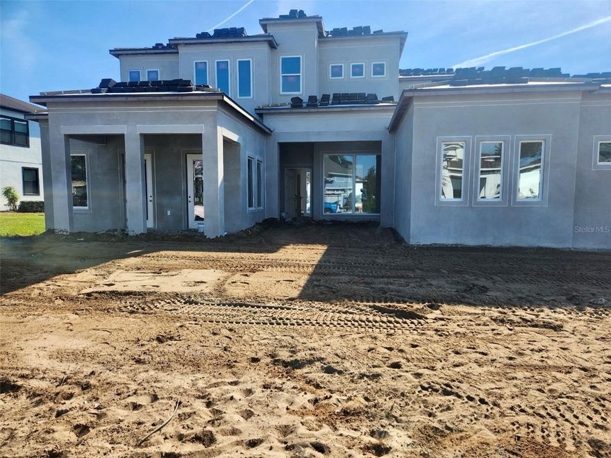 Under Construction. Exquisite Luxury Estate in Shorefront Cove at Horizon West. Presenting a rare opportunity to own a premier residence in the sought-after Shorefront Cove community of Winter Garden’s Horizon West. This elegant two-story estate offers 6,442 square feet of impeccably designed living space, showcasing refined luxury, modern convenience, and breathtaking views of Huckleberry Lake. Boasting 6 spacious bedrooms, 6 full bathrooms, and 2 half baths, this home features dual primary suites, one on the main level and one on the upper level, bonus room, wet bar, theater, large lanai, and 4-car garage offering ample storage and convenience. This residence provides easy access to major highways, premier shopping, dining, entertainment, and top-rated schools, all within one of Central Florida's most desirable communities.