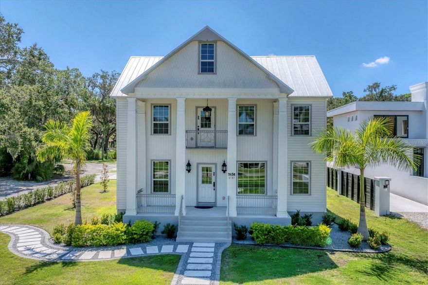 A fully renovated historic gem offering the best of both worlds — classic character and modern convenience. Every system, surface, and feature is new, yet the home retains its original charm, proportions, and design integrity. A historic residence crafted by some of Bradenton's earliest settlers has been spared from the threat of demolition. In 1871, Captain Bartholomew "Tole" Fogarty, alongside his wife Mary Ellen brought their dream home to life. Following two years of remarkable renovations, this house now stands proudly in a "move-in ready" condition. This three-story residence graces a generously sized lot, spanning over half an acre, and boasts an enviable location across the Manatee River. Stunning water views can be admired from a third floor. Its captivating curb appeal is enhanced by a grand front porch adorned with grand columns, while the second floor offers a balcony off the primary suite. A city park with a playground adjoins the backyard, perfect for leisurely strolls along Riverview Blvd, where you can admire both modern mansions and historic homes. Situated just a short drive away is the charming community of "Fogarty," and the renowned Anna Maria Island beckons with its sandy beaches and an array of restaurants. Words cannot capture the sheer beauty of this 4,000+ square foot residence featuring five bedrooms and 4.5 bathrooms - it truly is a dream home. The main level will astound you with its oversized kitchen, splendid cabinetry, built-in appliances, a lengthy kitchen island, and a breakfast bar for your mornings. The dining room comfortably accommodates a table for fourteen, and the spacious living room is destined to become a gathering place for your entire family. Additionally, the main level boasts a private suite with a walk-in closet and a full bathroom. The second floor, with its rich woodwork, transports you back to the 19th century. The primary suite features numerous windows that flood the space with sunlight and provide picturesque water views. The primary bathroom impresses with its size, double vanity, spacious walk-in shower, and a luxurious clawfoot bathtub. Enjoy your morning coffee on the private balcony. The convenient laundry room is also located on the second floor. On the opposite side of the second floor, you'll find the third suite, ensuring complete privacy for guests or family members. The third floor is a true delight, featuring two bedrooms and a versatile "play/study room." It also houses a full bathroom and built-in storage closets. If you desire more outdoor space, the house includes a second-floor porch, ideal for sunbathing or creating an outdoor entertainment area - let your imagination run wild. With an oversized two-car garage, a carport, and a lot exceeding half an acre, there is ample room for a substantial pool. This home is located just a few minutes away from IMG academy and Anna Maria Island. Don't miss the opportunity to visit this incredible home today!