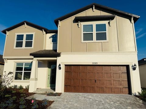 Photo of 33301 Binding Ties Ln, Wesley Chapel, FL 33545 (MLS # J995764)