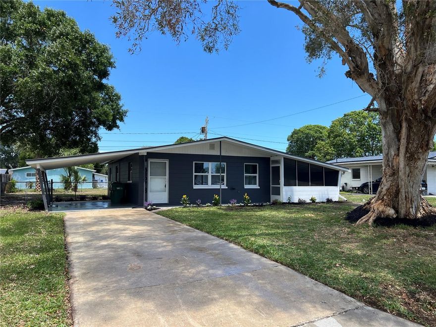 Welcome to this recently renovated 3 bedroom home, with AC and Duct work (2026), interior and exterior paint, luxury vinyl floors, 5 inch square baseboards, new kitchen cabinets , quartz counters and new appliances. Enjoy the convenience of a covered screened-in lanai, washer and dryer hookup and a large fenced yard. This home is located near major roads, shopping, restaurants and schools. This home wont last!