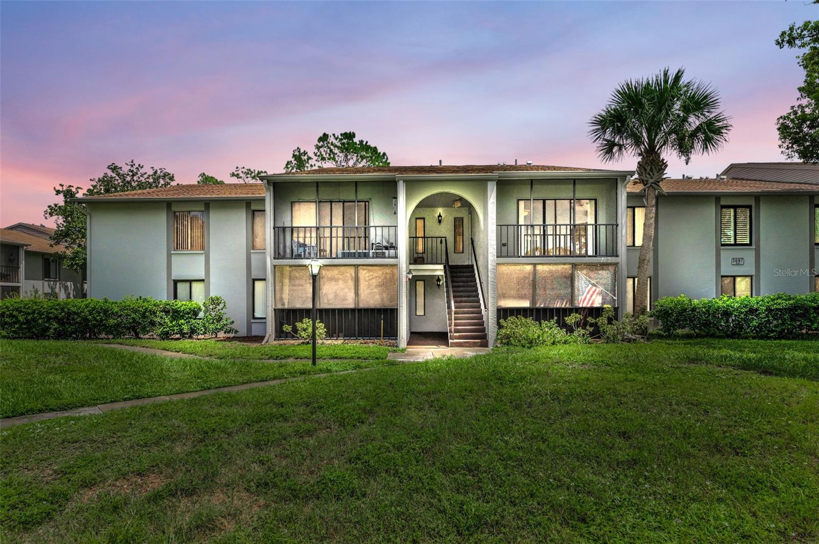 One or more photo(s) has been virtually staged. Welcome to Pine Ridge At Palm Harbor, a pet-friendly retirement community! This wonderful 2nd floor 1 bedrroom condominium features a large floorplan with 805 sqft (including the patio). Freshly painted and ready to move in as your primary residence, vacation home or investment property. No wait-time to rent as a new owner. Top floor, no neighbors above! And no carpeting! High-quality wood-look plank flooring throughout, including the bedroom and inside the large large walk-in closet which also has custom, built-in shelving. The kitchen has plenty of storage and the cabinets have updated, raised-panel doors. All appliances included. The bathroom offers a bathtub with shower and dual access doors from both the hallway and the spacious bedroom. Large living area has slider doors that lead to an enclosed and screened pato. Convenient inside laundry closet located off of the tiled kitchen, washer/dryer included. BONUS: Buyer's have peace of mind; seller's are offiering a one year home warranty! Low HOA fees $334.06 include roof, cable, internet, sewer, trash, water, heated pool, heated spa, clubhouse, walking trails, grounds maintenance, an on-site manager and more. Pine Ridge is a great location nearby beaches, Honeymoon Island State Park, restaurants, shopping, medical and dental facilities. Call for your private in-person or live virtual tour today!