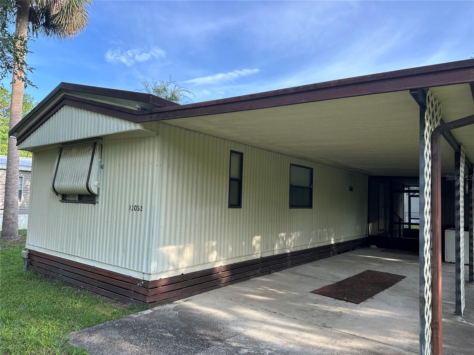 OWNER MOTIVATED!! Looking for an affordable 2-bedroom, 1 and one half bath manufactured home with NO HOA? Enjoy the spacious and inviting open floor plan, ideal for entertaining, living, and relaxing. Step outside to a large screened patio, perfect for enjoying evenings outdoors. The property features a large outdoor storage shed and is completely fenced for added privacy. With a convenient carport and durable metal roof, this home combines comfort and functionality. Close to Springs, the Ocala National Forest, within driving distance to the Beach, and yet still close to town! Don't miss out on this fantastic opportunity – schedule your viewing today!