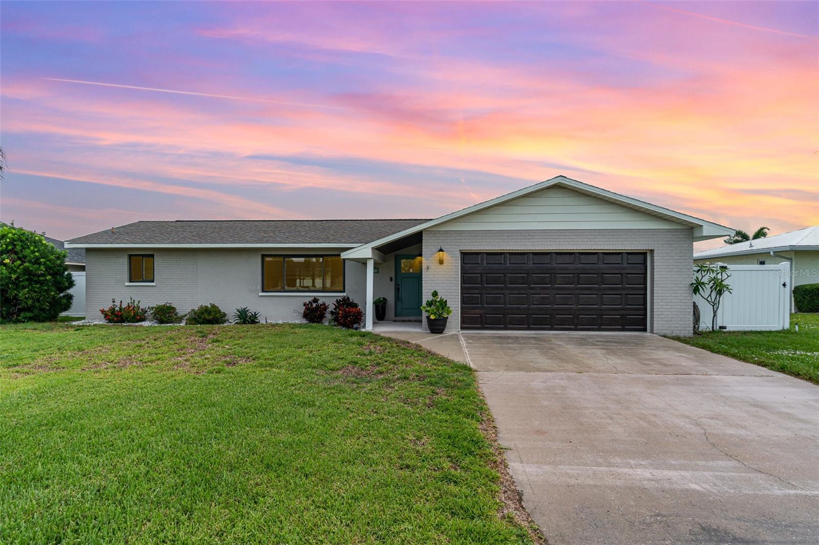 This is THE ONE you’ve been waiting for. Just moments from Palma Sola Bay and to the world-famous beaches of Anna Maria Island, this stunningly remodeled pool home offers the best of Florida living. With Cortez Beach (3.5 miles), Holmes Beach (5 miles), and Anna Maria Island (6.5 miles)—you can easily bike or drive to the coast for a sunset stroll, a beach day, or dinner by the water. Enjoy walking from your home to the bay for manatee sightings and sunsets. Have the freedom of no HOA, and a vibrant coastal lifestyle all from your private retreat thoughtfully updated with quality finishes and features throughout. Inside, you’ll find a light-filled split floor plan with vaulted ceilings, three spacious bedrooms each with walk-in closets, and a sleek, modern kitchen with Quartz countertops, KitchenAid appliances and a convenient pass-through window that opens to the back deck - perfect for entertaining. IMPACT WINDOWS and DOORS (2017) provide you peace of mind, while the outdoor space includes a resurfaced saltwater pool (2019), a brand-new lanai cage (2025), new pavers, a fully fenced yard, and a 10x12 storage shed. Additional upgrades include a new HVAC system, pool pump (2025), and hot water tank (2022) Plus, there's a convenient pool bath with tub and granite countertops. Whether you're relaxing by the pool or enjoying the natural beauty just beyond your doorstep, this home combines comfort, style, and location in one exceptional package.