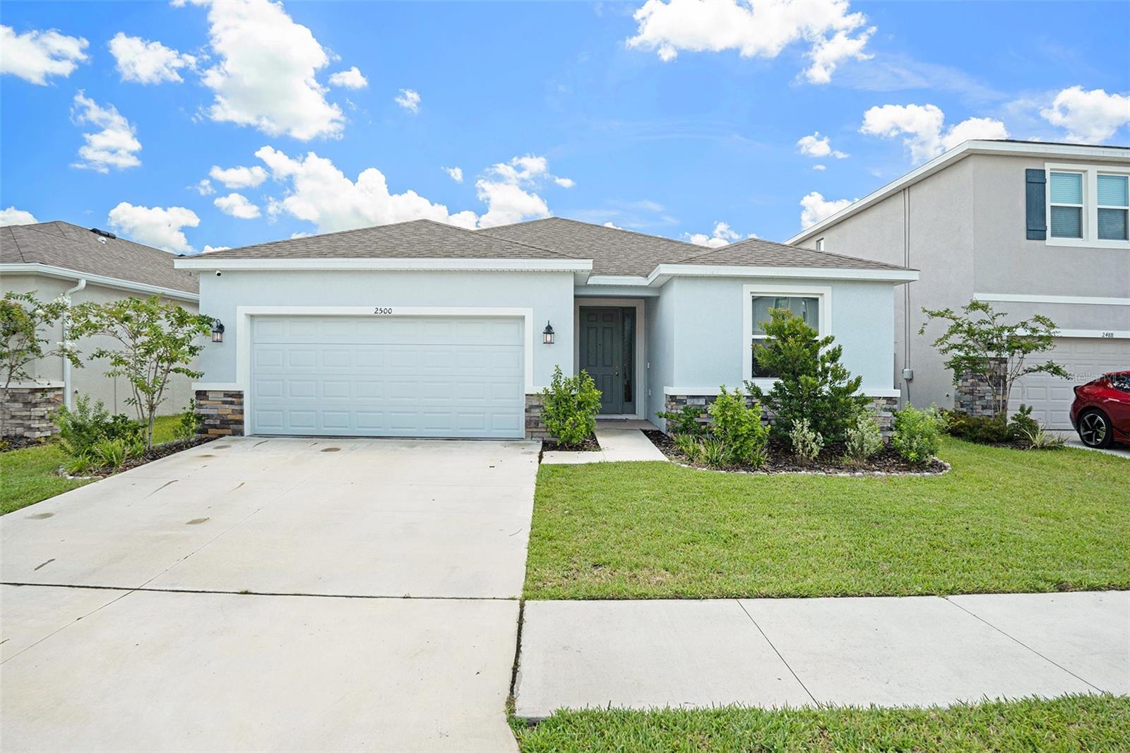 Welcome to this stunning 2024 built home in the Woodcreek community. Featuring 4 bedrooms and 2.5 baths, this bright, open-concept floor plan offers ideal family living. The gourmet kitchen, complete with center island and ample storage, flows into the dining and living areas-perfect for hosting family gatherings! At the center of this growing city, you’ll be just 15-minutes from I-75 and Tampa Premium Outlets, Main Event Entertainment, and just 5-minutes from Wiregrass Mall and its several dining establishments such as Grill Smith, Red Robin, Noble Crust, and countless other options.