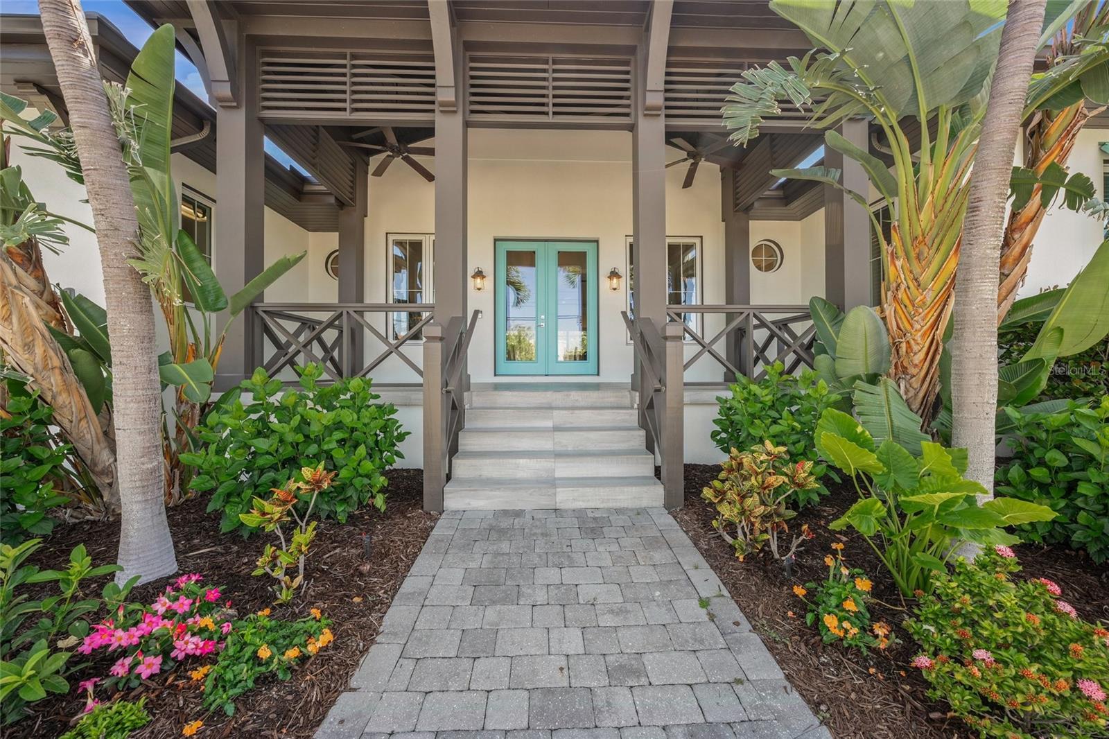 LOCATION, LOCATION, LOCATION !!! One Block to the Crystal Sands of Siesta Key Beach the #1 Beach in the USA! Or spend the day on the Aqua waters with two boats on lifts out back, and 119' of frontage on the Grand Canal leading to the ICW (only one bridge with about 15’ clearance to the Gulf). Oversized 16,163 sf Lot, elevated concrete block home and spectacular pool in your view from most every room! Not just the best location, but this custom-built in 2016 West Indies style home is a fortress all on one level, and is well above flood plain. High and dry through the "storms of the century" in 2024. Beautiful, engineered hardwood floors, and everything freshly painted inside & out. Custom cabinetry and built-ins, as well as several new appliances, including a True Ice Maker. Three large en-suite bedrooms. Four full Baths, a Den/Office/ 4th bedroom with murphy bed, an Open Concept Family room, Dining room & Kitchen, and an extra-large Great Room make living spacious and easy. Large walls of sliding glass doors in all waterfront rooms extend living spaces to a huge, screened Lanai which adds over 500 sf to living space. The total A/C space is 3,654 sf, with a total of 5,075 under roof. All hurricane rated extra heavy duty PGT doors and windows. The oversized 3-car garage with an Epoxy floor has a very high ceiling which allows 2 more cars to be added on lifts for a total of 5 vehicles for the enthusiast. Climate controlled enclosed attic storage is available above the rear part of the garage. Both Air conditioning systems and Hot water heater replaced in past year. The large free form pool and spa have new high end Pentair pool pump & heater & auto chlorinator. Both boats as well as professional decorator staged furniture, decor and pictures may be available for separate purchase for "Turn-Key" possession. DEFINITELY check out the Virtual Tour, since it provides “3D walk through any direction” photos which can really give you the flow of the house as you manipulate your way around.