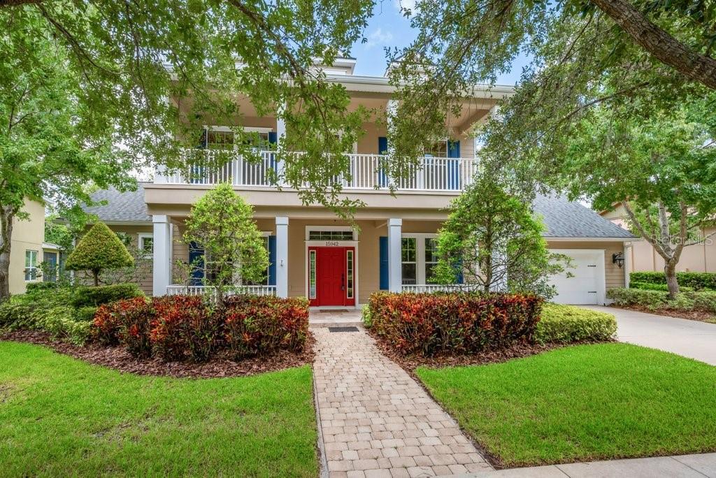 WOW! Come see this stately custom home in the highly sought-after Gated Ternwood Village of Fishhawk Ranch. Situated on one of the deepest conservation lots, this nearly 4,000 sq ft residence offers 4 spacious bedrooms, a versatile bonus room with closets (possible 5th bedroom), dedicated home office, and a ** 3 - CAR TANDEM GARAGE, plus a screened lanai and wooded views! From the beautifully landscaped yard, brick paver walkway, and charming front porch(s) to the unforgettable elevation, curb appeal abounds. Step inside to walnut hand-scraped hardwood floors flowing through the formal living spaces and family room. The gourmet kitchen is a chef’s dream with 42” cherry cabinetry, granite countertops, stainless steel appliances including a 6-burner gas cooktop and double ovens, two pantries, a butler’s pantry, and recessed lighting. The luxurious first-floor primary suite features private patio access, dual walk-in closets, and an incredible en-suite bath with a Roman walk-in shower, granite-topped vanities, garden tub, and custom finishes throughout. Upstairs, enjoy a massive bonus/playroom and three additional bedrooms, two with unique dormer architecture and vaulted ceilings. Additional highlights include built-in bookcases, a gas fireplace, dual-pane low-E windows, radiant barrier insulation, attic with storage, surround sound, screened lanai, fenced backyard with direct access to walking trails, and a tiled upstairs balcony. All this within the amenity-rich Fishhawk Ranch community—offering top-rated schools, resort-style pools, miles of trails, playgrounds, sports facilities, and vibrant Park Square just steps away. Don’t miss this exceptional opportunity—schedule your private showing today!