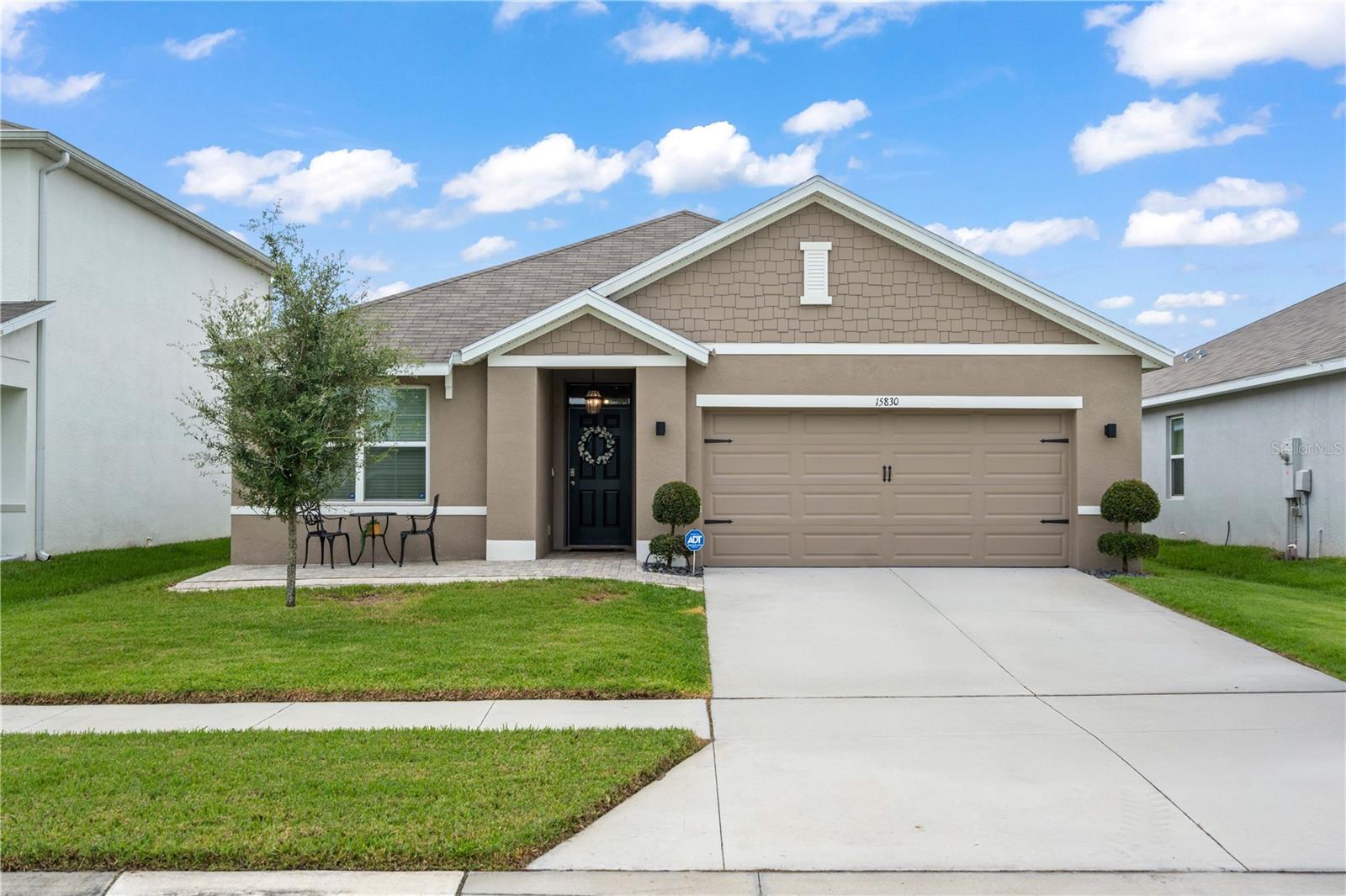 This beautiful 3 bedroom, 2 bathroom home that feels like new, with an open floor plan for both everyday comfort and entertaining. The heart of the home is the upgraded kitchen, complete with sleek granite countertops, stainless steel appliances, a water softener system, and a reverse osmosis water filtration system for added peace of mind. Tile flooring runs throughout the main living areas, while cozy carpet creates a warm retreat in the bedrooms. The spacious primary suite features two closets and a private ensuite bath with a walk-in shower. The secondary bathroom offers a tub, perfect for guests or family needs. A garage conversion provides flexible space that can be used as an office, storage, or hobby room. Step outside to a tranquil screened-in lanai where you can relax with peaceful conservation views. The backyard is fully fenced, ideal for pets, play, and privacy. Out front, the home has pavers and a front porch, enhancing both curb appeal and functionality. This home sits on a prime lot directly across from a park, offering fewer neighbors and more open space to enjoy. With a whole-home security system and thoughtful custom features throughout, this property is truly move-in ready. With close proximity to Publix and easy access to the Suncoast Express way, and only 30 minutes from Tampa. Don’t miss your chance to own this stylish and well-maintained home in the highly sought-after Preserve community!