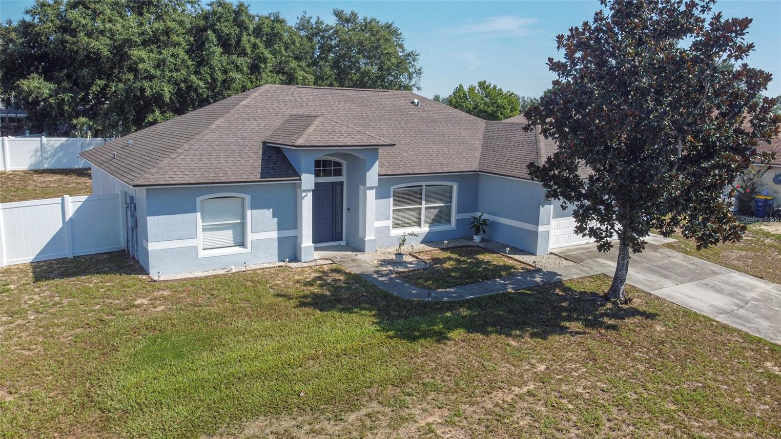 Located in the Heart of Lake County, the 100 year old City of Mascotte Florida awaits. With a population of just over 6000 people, Mascotte is a city just West of Orlando and Clermont, East of Sumter County, South of Leesburg and North of Disney. It is there you will find this 3 bedroom 2 bath home where the direction of your journey is always worth the travel, but never to far to travel. Located in the neighborhood of The Cardinal Pines Estates, this beautifully maintained 3 bedroom 2 bath home, has high ceilings and a flex room with not one, but two doors to enter and exit from. The rear door of the Flex Room is convenient for guests as it leads into the Jack n Jill bathroom, which is accessible from both bedroom one and bedroom two. In this home, all three bedrooms have plenty of space to satisfy that furniture that is a "MUST HAVE" when moving in the new home! The primary bedroom is on the opposite side of the great room and kitchen area with a walk in closet and private bathroom, with the garden tub and walk in shower. The laminate flooring has been replaced in all rooms except bedrooms, where there is carpeting. THIS HOME HAS A NEWER ROOF and NEWER WATER HEATER (with in the last 6-7 years) < NEW A/C 2021<PAINT 2022< DISHWASHER AND WASHER /DRYER 2023 and VINYL FENCING 2024. The Open FLOOR PLAN is great for all sizes of families and plenty large enough for entertaining a few or a whole house of friends. The kitchen is loaded with cabinets, stainless steel appliances and plenty of space for your favorite gathering table! Whether you are just starting your Home Ownership Plan or thinking about an addition to the family, this home fits perfectly for it's size, location, updated conveniences, fenced in yard and BEST OF ALL, the pricing. We Can Show It and You can Own It!! Call us today to schedule your private showing!