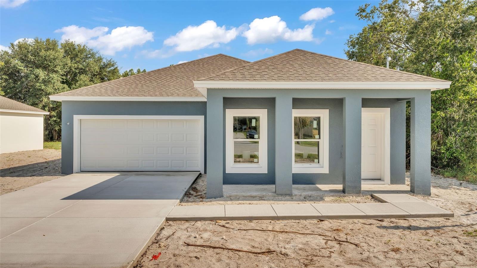 Pre-Construction. To be built. *TO BE COMPLETED IN SEPTEMBER* Discover the perfect blend of modern living and convenience in this brand new 3-bedroom, 2-bathroom home located in the heart of Winter Haven, just minutes from the serene shores of Lake Hartridge. Best of all, there’s NO HOA to worry about! As you step inside, you’ll be greeted by a bright and airy open floor plan that flows seamlessly throughout the home. The luxury vinyl plank flooring adds both elegance and durability, making it a great choice for busy households. The heart of the home is undoubtedly the beautiful kitchen, which features stainless-steel appliances, quartz countertops, and plenty of cabinetry to store all your cooking essentials. The kitchen design allows for easy interaction with guests in the spacious living room, ensuring you never miss a moment while entertaining. Retreat to the primary bedroom, a sanctuary designed for relaxation. This inviting space comes complete with a generous walk-in closet and a luxurious ensuite bathroom, featuring dual sinks and a modern walk-in shower—providing a perfect spot to unwind after a long day. The two additional bedrooms are thoughtfully designed with equal sizing and each boasts a walk-in closet, ideal for family members or guests. The second bathroom, conveniently located near the entrance of the home, includes a shower and tub combination, offering both comfort and functionality. Situated in the heart of WinterHaven, this home places you in close proximity to a variety of retailers, restaurants, and shops, ensuring you have everything you need right at your fingertips. Plus, the adjacent home is also available for sale and currently under construction, offering a unique investment opportunity. Don’t miss your chance to own this exceptional new home in Winter Haven—schedule a tour today and envision the possibilities!