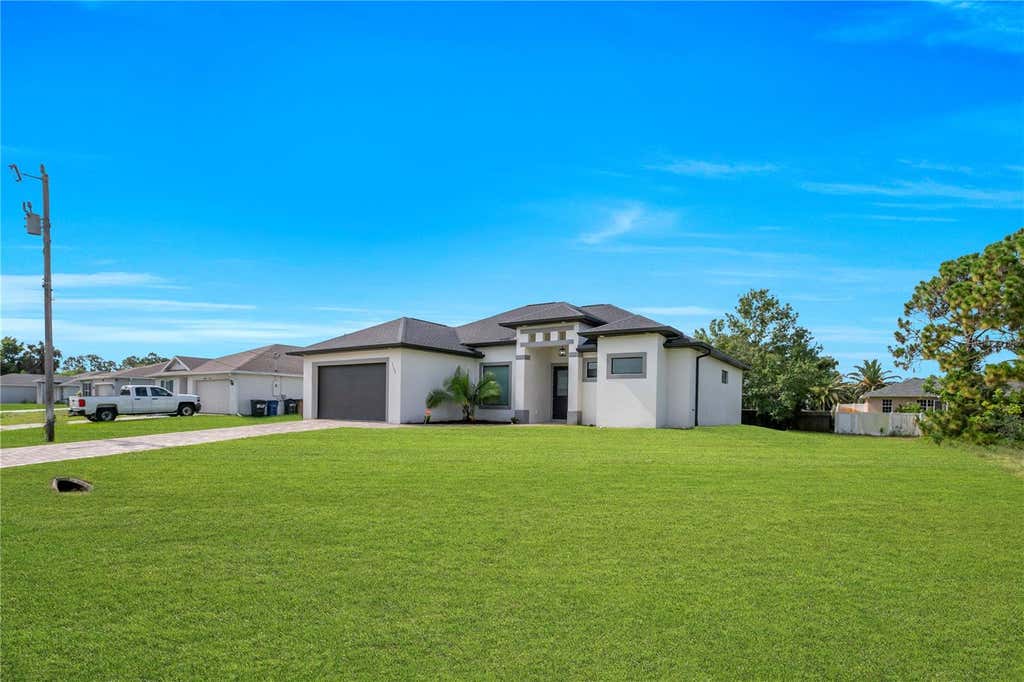 Photo of 3509 38th St SW, Lehigh Acres, FL 33976 (MLS # TB8535736)