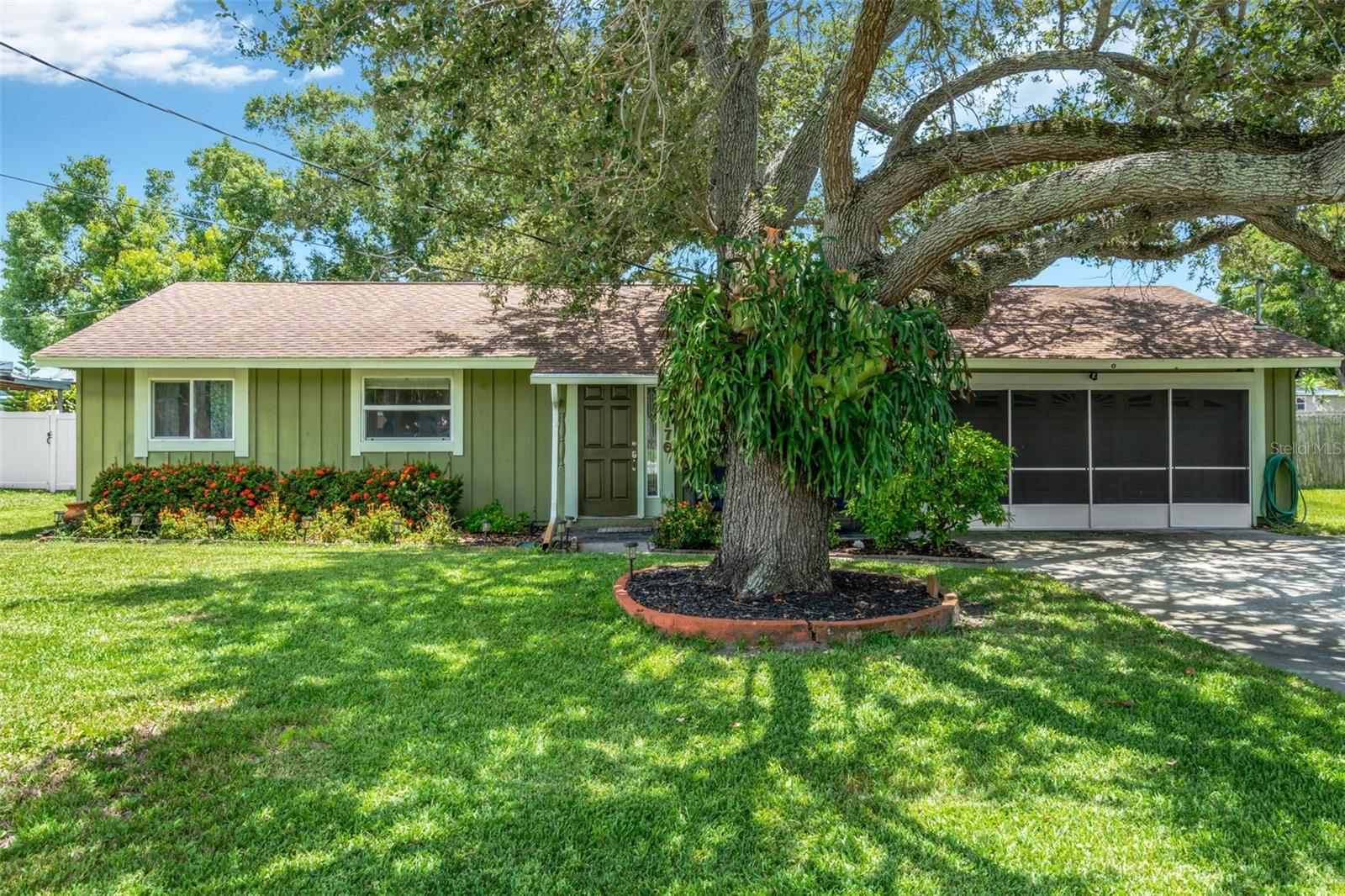Beautifully maintained 3-bed/2-bath home perfectly positioned just minutes from the Gulf Beaches. Tucked away on a quiet street with no HOA, this property blends comfort, convenience, and the true Florida lifestyle.Inside, you’ll find an open and functional floor plan with great natural light and new flooring (2024) throughout the main living areas. Step outside to an amazing outdoor setup featuring a raised, covered deck with a fully built-in outdoor kitchen. The newly fenced yard (2025) also includes a 10x15 powered shed and still provides plenty of room for a boat or RV. The exterior of the home was also freshly painted in 2024. This is a fantastic opportunity to own a move-in ready home in one of the most convenient locations.